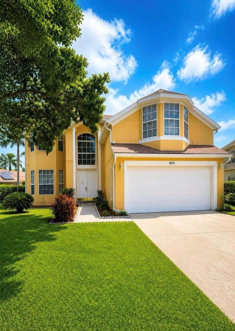 Photo of 6619 Mangrove Chase Avenue, Orlando, FL 32809 (MLS # O6434134)