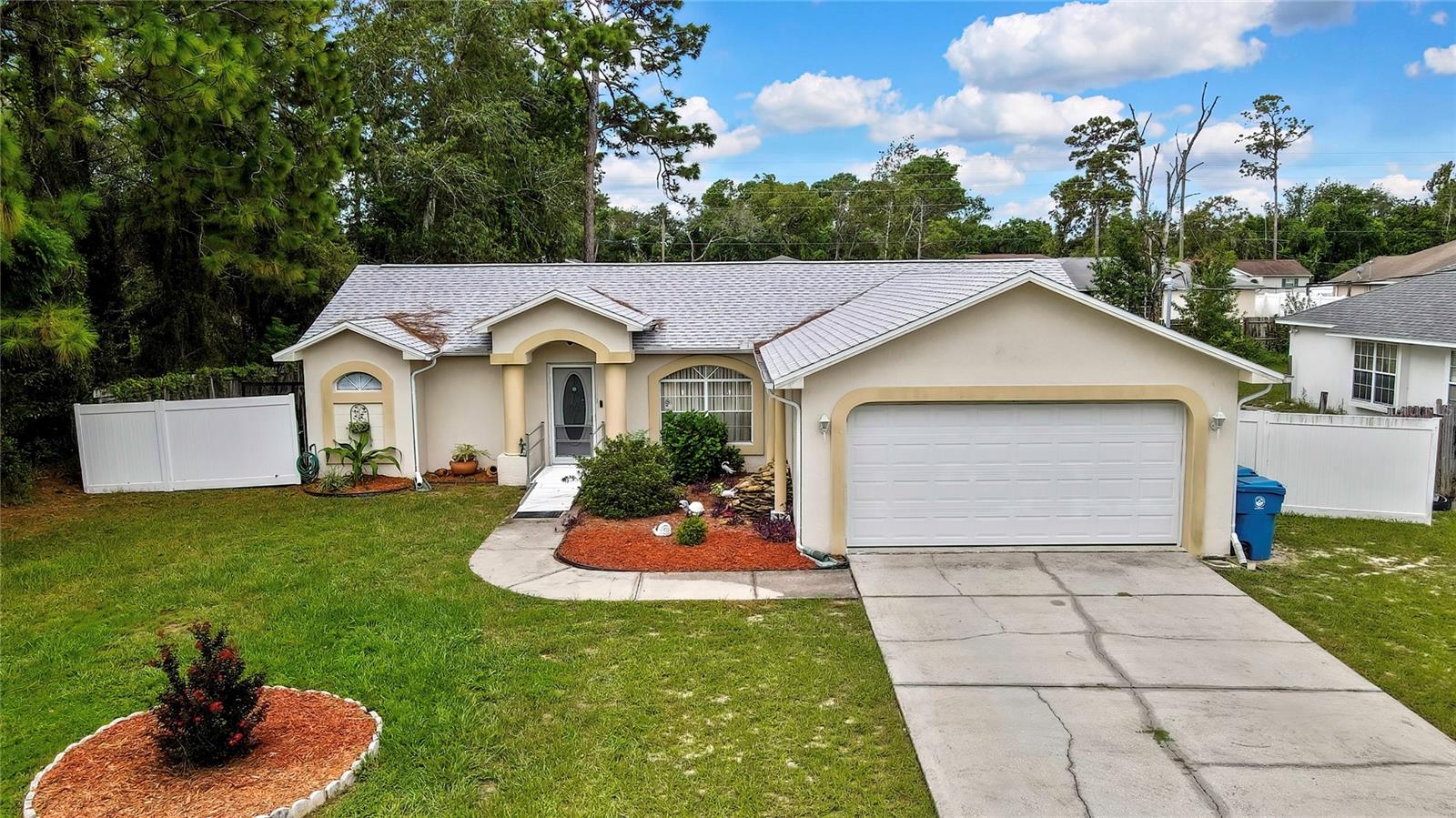 Wonderful, move in ready 3/2/2, in a nice neighborhood. New roof in 2024 and comes with two large storage buildings. Open and split floor plan, cathedral ceilings, with a large lanai to enjoy your backyard. Move right in and add your personal touches to really make this one your own.