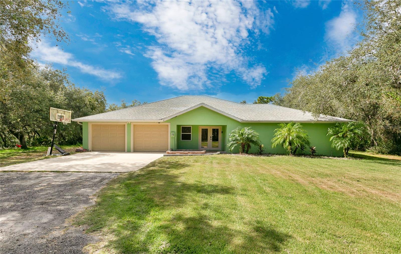 Your Florida Oasis Awaits!
Set among towering oaks on 6.3 acres, this stunning home combines space, style, and luxury with 2,530 sq. ft. of beautifully designed living space (3,740 sq. ft. under roof). Featuring 4 bedrooms and 2 bathrooms, the home showcases rich hardwood floors throughout the common areas and new carpets in the bedrooms. The kitchen is perfect for entertaining and includes all the appliances plus built in wine cooler. Every detail reflects quality craftsmanship and thoughtful upgrades.
The oversized 24' x 36' 4-car garage provides plenty of room for vehicles, toys, or workshop projects. The master suite is a true retreat, complete with a custom shower featuring four showerheads, a skylight, built-in stereo, and towel warmer. Step outside to your pool patio, fully enclosed by a large screened enclosure, and enjoy peace of mind with a standby generator and transfer switch.
But wait—there’s more!
A 30' x 50' metal building, thoughtfully positioned out of view of the main house, opens up endless possibilities. Park all your toys, RV, coach, boats, or create the ultimate workshop or hobby space!
Seller is including a brand new roof with the purchase of the home!
Located in an equestrian-friendly community and a designated wildlife sanctuary, this property is perfect for horse lovers, birdwatchers, and anyone who appreciates Florida’s natural beauty. Centrally positioned just an hour from Orlando, Tampa, or Vero Beach, you’ll also find five lakes within 10 minutes, plus quick access to River Ranch, Kissimmee River, and Triple Canopy Ranch for ATV adventures.
Experience the perfect blend of privacy, luxury, and outdoor living—this is Florida at its finest!