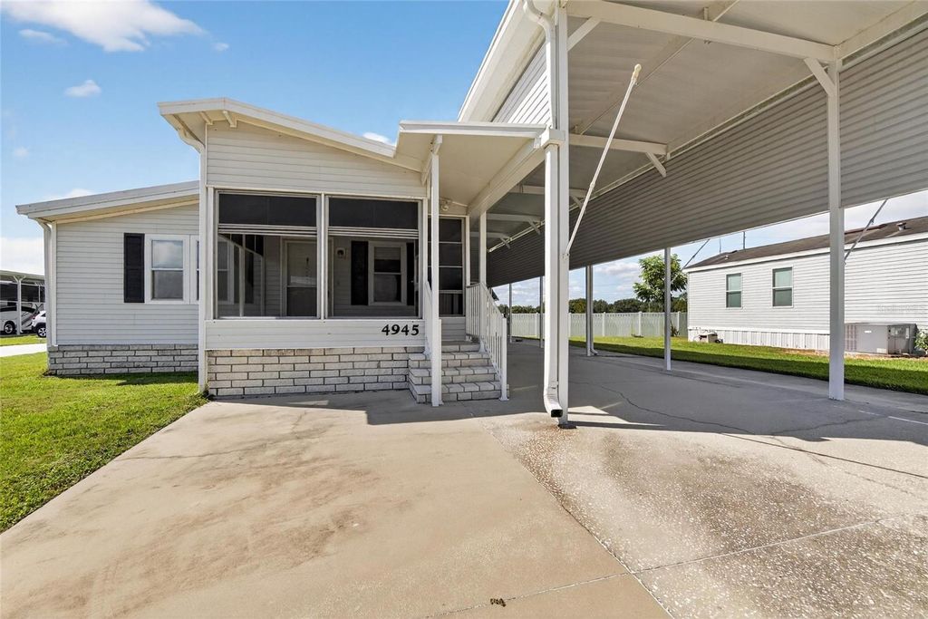Photo of 4945 Shore Line Dr, Polk City, FL 33868 (MLS # L4956694)