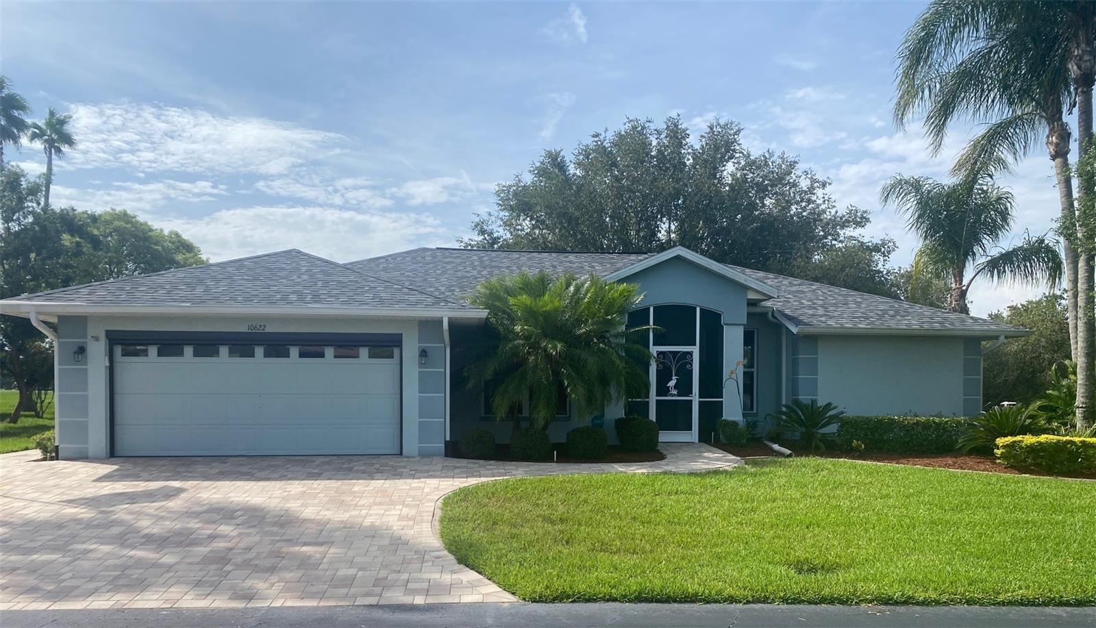 PROFESSIONAL PHOTOS, INCLUDING AIREALS WILL BE POSTED LATER THIS WEEK, WEATHER PERMITING. Here's a beautiful, updated 1,648 square foot home in the highly desirable Tampa Bay Golf & Country Club community. The home is completely updated and move-in ready. The kitchen is amazing and features solid wood, white cabinets (a lot of them), tasteful granite and backsplash. The HUGE Primary Bedroom has newer carpet, and an amazing walk-in closet with organizers and a completely updated ensuite with beautiful granite and an amazing shower. The home has 3 solar tubes which ensure the home is bright without lights! The guest bedrooms, and bath, are situated on the other side of the home for privacy. The guest bathroom has a newer state-of-the-art jetted walk-in bath that you have to see to believe! Enjoy your morning coffee (or afternoon wine) sitting in your luxurious lanai, with glass windows, enjoying all the wildlife in your private backyard...you'll soon discover why this sub-HOA is named Deer Hollow! The HUGE lanai adds an additional 444 square feet of living area, on top of the 1,648 square feet! A beautiful paver driveway leads you to the screened two-car garage home on one of the best lots in the amazing Tampa Bay Golf & Country Club community. The lanai has ceramic tile flooring, upgraded windows, HVAC ducts, and the most amazing views you could imagine, including a beautiful pond and amazing golf course views. New roof installed November 2024. TBG&CC has two incredible golf courses, the 18-hole Championship course and a 9-hole executive course. The golf courses here are impeccable and very well maintained. Tampa Bay Golf & Country Club is Tampa Bay's premier active 55+ community featuring two swimming pools (the large resort-style pool has fountains and is heated to a balmy 80 degrees). Pickleball, tennis, cards, bocce, shuffleboard, cornhole and more activities than anyone could possibly do! Our new activities center has a HUGE fitness center with state-of-the-art fitness equipment, a beautiful billiards room, and an amazing card room. TBG&CC has no CDD and very affordable HOA charges, which include Cable/Internet/DVR and Mini Box. The Tampa Bay Golf & Country Club community is Tampa Bay's most desirable 55+ Active community. There is a ONE-TIME charge of $3,500.00 for the Tampa Bay Community Association Social Membership due at closing. All room sizes are approximate and should be confirmed by buyer. Furniture is available outside of contract.