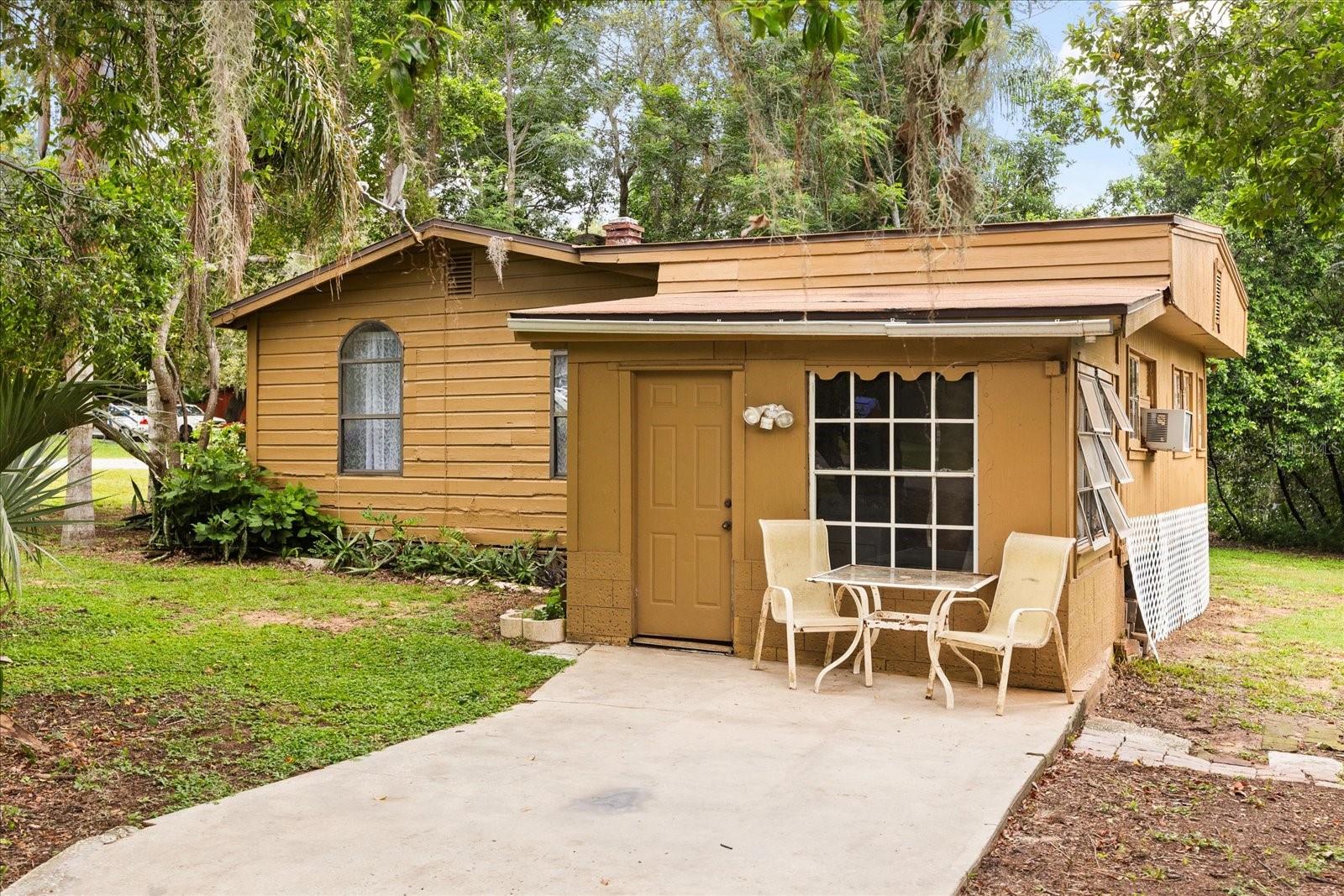 Location! Condition! Price! This home has it ALL!
Discover the charm of this cozy, cabin-style gem nestled in the heart of Lake County! Located in the beautiful and historic Town of Montverde, this 1-bedroom, 1-bathroom single-family home offers a rare opportunity to own a piece of local history—originally one of the area’s beloved fishing cabins from Montverde’s days as a popular fishing retreat.
Sitting proudly on a spacious corner lot with NO HOA, this property boasts lake access to Lake Apopka, plus a lush yard dotted with palm trees, orange trees, and a vibrant birdwatching scene. Enjoy peaceful mornings or evening sunsets from your open patio, and take advantage of the scenic walking trail right across the street.
Inside, you’ll find vinyl flooring throughout—NO carpet—and a clean, well-kept space with loads of potential. With just a little TLC, this home could be transformed into the perfect retreat or weekend getaway.
The location truly shines: just minutes to the Clermont library, local parks, shopping, dining, and with quick access to the Florida Turnpike, commuting is a breeze. This friendly, small community offers the perfect blend of tranquility and convenience.
Whether you're looking for a full-time residence, a weekend escape, or an investment opportunity—this is one you don’t want to miss!