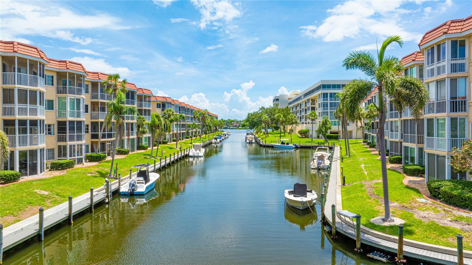 Live the Florida dream in this fully furnished, designer-finished 2 bedroom, 2 bathroom condo nestled within the coveted Siesta Harbor community, offering deeded beach access to world-famous Siesta Key Beach just across the street. Situated on the third floor with picturesque water views, this beautifully updated unit features granite countertops, white shaker cabinetry, stainless steel appliances, and newer laminate flooring throughout. Enjoy peace of mind with impact windows and custom plantation shutters, while the enclosed lanai with sliding glass windows provides a serene retreat year-round. The open-concept layout flows seamlessly from the modernized kitchen into a bright and welcoming living space, perfect for entertaining or relaxing. Both bathrooms have been tastefully renovated, including a fully remodeled guest bath, and the entire unit was freshly painted in 2025. Additional features include a private storage closet, updated lighting, and high-speed fiber optic internet. Siesta Harbor is a vibrant 55+ waterfront community along the Intracoastal Waterway, offering a heated pool, spa, clubhouse, fitness center, shuffleboard, fishing dock, kayak launch, BBQ area, and boat slips for up to 30’ vessels. Whether enjoying your morning walk to the beach, catching the free trolley to Siesta Key Village, or heading over the nearby bridge to explore downtown Sarasota’s dining, shopping, and cultural scene, this location offers the ultimate in coastal convenience and lifestyle. With monthly rentals allowed 12 times per year, it’s ideal as a personal escape or investment property. **THIS PROPERTY QUALIFIES FOR A 1% LENDER INCENTIVE IF USING PREFERRED LENDER. INQUIRE FOR MORE DETAILS.**
