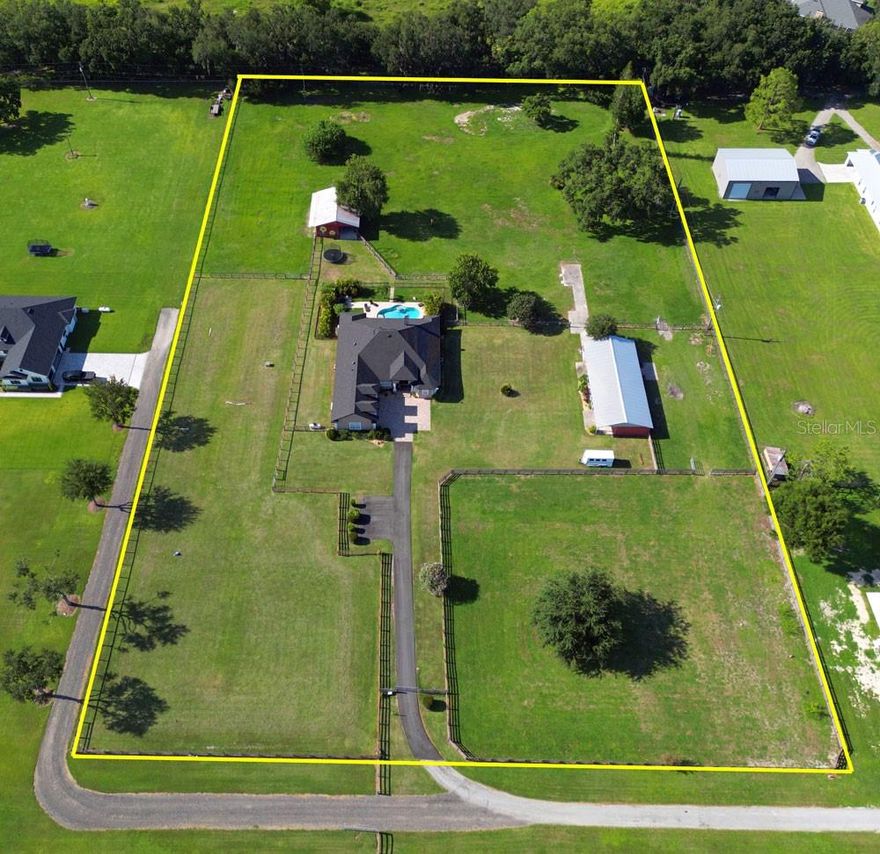 Acreage Lover’s Dream Estate Home With 2 Barns on 4.91 Acres that includes a 4BR, 3.5 baths, 3 car garages, movie room and 2 Barns & 4 Pastures And a Heated Salt Pool !  Or could be a great property for Equestrians or your car collection or toys too!  Also for car enthusiasts, we are a hop skip and a jump to Circuit Florida too!

Set on nearly 5 acres, this beautifully updated property offers the best of country living with modern comfort. The spacious 4-bedroom plus bonus office, 3.5-bath home including a 3-car garage is complemented by a heated saltwater free-form pool (2020) with built-in table in the pool for in-pool dining is perfect for entertaining or unwinding. A fenced pool area with child safety gate and additional separate fenced pet run adds convenience and peace of mind. And Roof was replaced in 11/22!

Equestrian facilities and pastures are thoughtfully designed and ready for your horses include Two barns with 3 stalls, an additional large open stall, tack room, feed room, and barn storage.  Barn 1 size 40x30 Barn 2 size 68x30

Four well planned fully fenced pastures for grazing and rotation, Secure wood and post horse fencing throughout with the majority of which includes no-climb 2x4 wire fencing.

This move-in ready equestrian retreat combines practical updates with resort-style living. Whether you’re looking for a working farm, a horse-friendly homestead, or a peaceful retreat, or just a place to enjoy your toys, this property checks every box !

For Internet, Frontier Fiber 1gb is on site along with Spectrum too ! 

Plus an excellent location in North Auburndale, the gem of Polk County !  Easy access to I4, the Polk Parkway, Lakeland, Winter Haven and an excellent location in between Orlando and Tampa with super access to all the Disney parks, Universal Parks and SeaWorld too !  Added bonus is typically 50-55 min to Orlando's MCO airport !