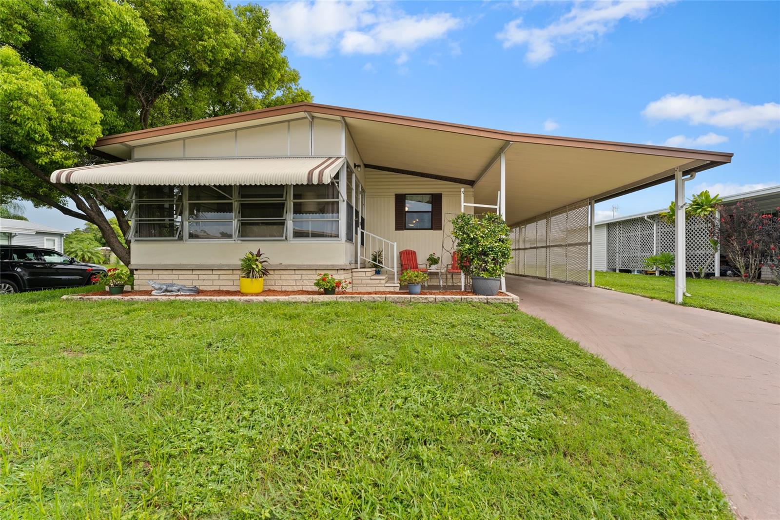 Motivated Seller!! 2 Bedrooms PLUS OFFICE!! This FEE SIMPLE home (you own the land) is the best value on the market in the 55+ Community of Briar Creek. From the moment you hear the key turn in the door, you’ll know you’re unlocking “home”. The charming curb appeal foretells the feeling that great future memories will be made here. Upon entering this CORNER LOT home, you will appreciate the move-in-ready appeal. Featuring an open-floor plan, a covered carport and massive storage area, this well-maintained mobile home also has newer laminate floors all throughout. The kitchen opens to the family room and dining room for family gatherings. Amenities this home offers, including a Florida room, a laundry room complete with washer and dryer, an en-suite Master Bed/Bath, and ample closet space. The Florida Room might become your favorite cozy space to curl up and read, or sip your morning coffee.. There's nothing not to love about this beautifully designed home. Community Features Include: A heated community pool, clubhouse and shuffleboard courts! It's also near the downtown attractions of Safety Harbor and Dunedin! The Roof is 2012, and the HVAC is 2019. An HOA fee of $241 per month includes water, sewer, trash, and lawn maintenance. High and Dry with NO Storm Damage from recent hurricanes!! This property is allowed to have a cat or a dog up to 25 pounds. Don't let this great home slip away, schedule your appointment today!