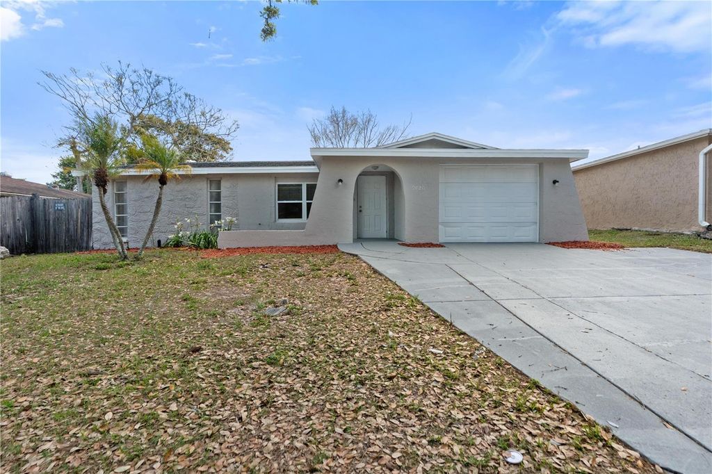 Photo of 9020 Hunt Club Lane, Port Richey, FL 34668 (MLS # W7883846)