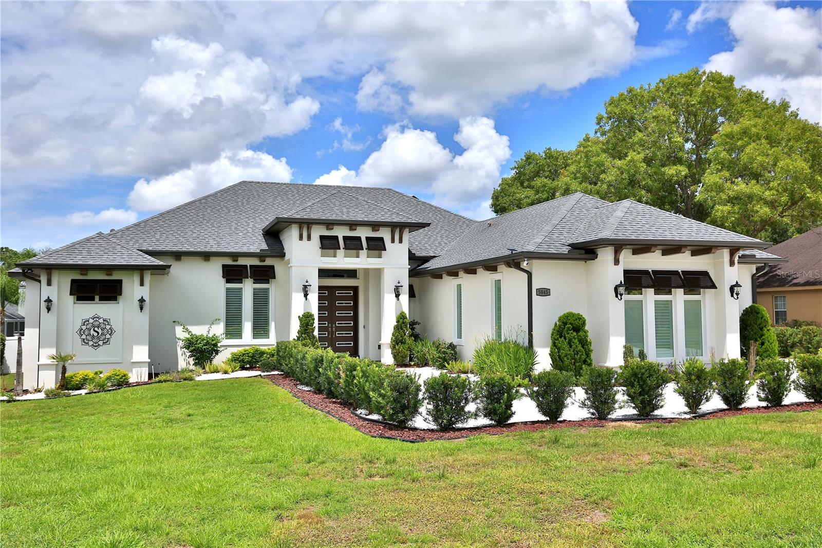 Located in Hunt Club at Fox Point residence, ideally situated on an expansive 0.55 +/- acre lot. This luxurious property features an open and airy layout, ideal for modern living and entertaining.
Step inside to find a spacious living area that seamlessly connects to a gourmet chef's kitchen, equipped with elegant custom cabinetry, quartz countertops, a large center island, and top-of-the-line appliances. Enjoy three generous en-suite bedrooms, including a serene master suite with a private bathroom oasis. There's also a bonus area currently set up as a workout room. The office, bathed in natural light, has a large window with beautiful views, making it perfect for work or study.
Step into the inviting living area, where retractable glass sliding doors open up a versatile space that can be transformed into a pool table area, bar, game room, or media room, tailored to fit your lifestyle. This space seamlessly connects to an additional set of sliding glass doors fitted with sun-blocking electric shades, leading to a spacious and screened enclosure, with access to a ½ bath perfect for hosting dinners or entertaining guests year-round.
Venture outside to the expansive backyard, where a beautifully designed paver pad sets the stage for cozy evenings around a fire pit, making unforgettable memories with friends and family. Encircled by a privacy fence, this outdoor oasis offers a tranquil escape. Plus, a generously sized storage building equipped with electricity provides the convenience you need for all your tools, toys, and more.
Additionally, this home is equipped with modern energy-efficient features, including a built-in Franklin Home Power Solar system and a garage charging station for your electric vehicle, ensuring sustainability and cost savings.
Don’t miss your chance to make this house your forever home! Just minutes away from the World Equestrian Center and close to shopping, dining, and hospitals.