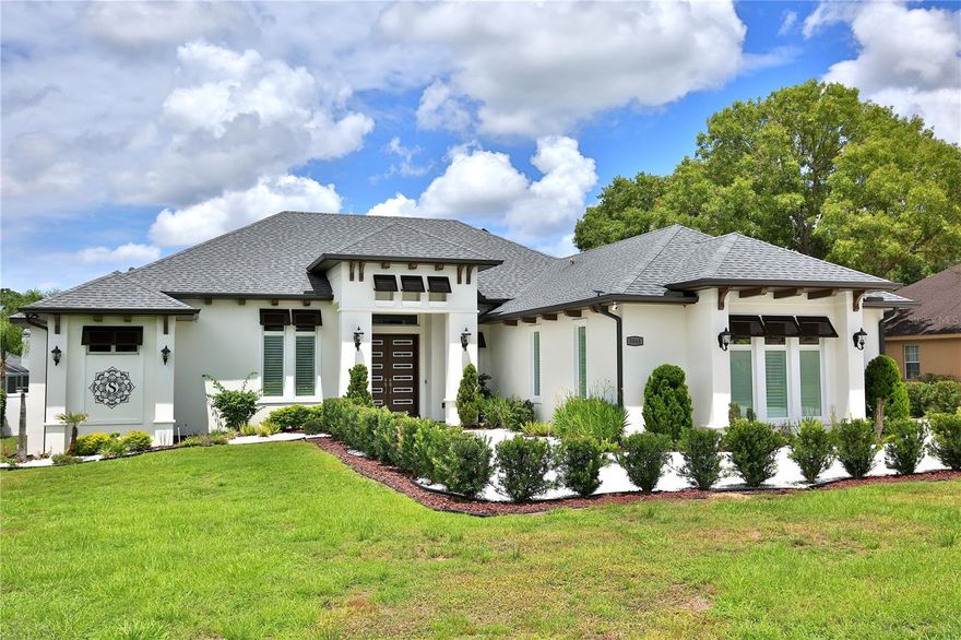 Located in Hunt Club at Fox Point residence, ideally situated on an expansive 0.55 +/- acre lot. This luxurious property features an open and airy layout, ideal for modern living and entertaining.
Step inside to find a spacious living area that seamlessly connects to a gourmet chef's kitchen, equipped with elegant custom cabinetry, quartz countertops, a large center island, and top-of-the-line appliances. Enjoy three generous en-suite bedrooms, including a serene master suite with a private bathroom oasis.  There's also a bonus area currently set up as a workout room. The office, bathed in natural light, has a large window with beautiful views, making it perfect for work or study.
Step into the inviting living area, where retractable glass sliding doors open up a versatile space that can be transformed into a pool table area, bar, game room, or media room, tailored to fit your lifestyle. This space seamlessly connects to an additional set of sliding glass doors fitted with sun-blocking electric shades, leading to a spacious and screened enclosure, with access to a ½ bath perfect for hosting dinners or entertaining guests year-round.
Venture outside to the expansive backyard, where a beautifully designed paver pad sets the stage for cozy evenings around a fire pit, making unforgettable memories with friends and family. Encircled by a privacy fence, this outdoor oasis offers a tranquil escape. Plus, a generously sized storage building equipped with electricity provides the convenience you need for all your tools, toys, and more.
Additionally, this home is equipped with modern energy-efficient features, including a built-in Franklin Home Power Solar system and a garage charging station for your electric vehicle, ensuring sustainability and cost savings.
Don’t miss your chance to make this house your forever home!  Just minutes away from the World Equestrian Center and close to shopping, dining, and hospitals.