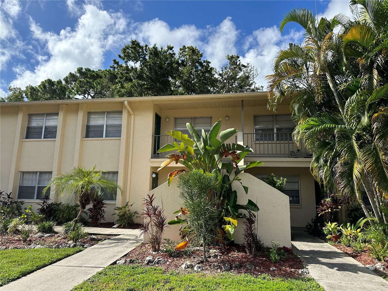 Spacious 2-bedroom, 1-bath second-floor walk-up condo featuring wood flooring in the dining room, hallway, and family room, with cozy carpet in the bedrooms. Water, sewer, garbage, and pest control are all included for added convenience. Enjoy community amenities such as a pool and clubhouse, plus assigned parking. Ideally located near Ringling College, New College of Florida, FSU, and the Ringling Museum — a truly great location!