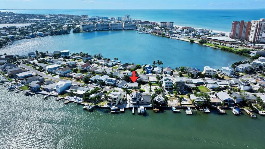 One or more photo(s) has been virtually staged. Step inside this beautifully renovated and professionally remediated home and discover a sanctuary that perfectly balances style and practicality! This gorgeous 2-bedroom, 1.5-bath residence, a short 5 minute walk to Redington Shores beaches with a peek-a-boo view of the intercoastal, offers a wealth of features that exceed expectations and embrace the essence of modern living. After being completely remediated and lovingly restored following last year's storms, this home showcases thoughtful upgrades throughout, including waterproof lower cabinets, sleek epoxy flooring, and durable waterproof Endura removable walls, all designed to give you peace of mind for the future. With brand-new appliances and fresh paint that radiates a coastal vibe, along with a new HVAC system, newer tankless water heater and all new electrical wiring and electric panel, every corner of this home has been crafted to ensure your comfort and peace of mind. The current flood policy is also assumable. Imagine stepping out into your own pocket of paradise, where the outdoor space has been thoughtfully designed for your ultimate enjoyment. Picture a beautiful outdoor area with pavers that serves as the perfect foundation for your outdoor furniture, inviting you to lounge in comfort while soaking up the sun. Envision the luxury of having a private outdoor shower, providing a refreshing retreat after a day spent frolicking on the beach or tending to your garden. The convenience of a 220V power outlet awaits, ready to accommodate your dreams of an outdoor hot tub, where you can unwind under the stars. Plus, with an 8'x12' utility shed, storage is effortlessly managed, ensuring your outdoor oasis remains uncluttered and serene. This is not just a space; it's a lifestyle where relaxation and entertainment seamlessly intertwine, making every gathering with friends and family a cherished memory. Experience the best of Florida living from the vibrant heart of Redington Shores, where the tropical beaches are just moments away, inviting you to soak in their natural beauty. Picture leisurely days spent lounging by the shore, followed by delightful evenings exploring the diverse array of local shops and dining options that cater to every palate. As a resident of the Surfside community, you also have the opportunity to join ($40.00 per year) the Surfside Beach Club. This gives you access to a private beach club with parking, picnic and barbecue areas. The convenience of living just a stone's throw away from the Tom Stuart Causeway provides easy access to St Petersburg and surrounding Tampa Bay areas. . Don't wait to Start Living today! Call to make an appointment and make this home your own.