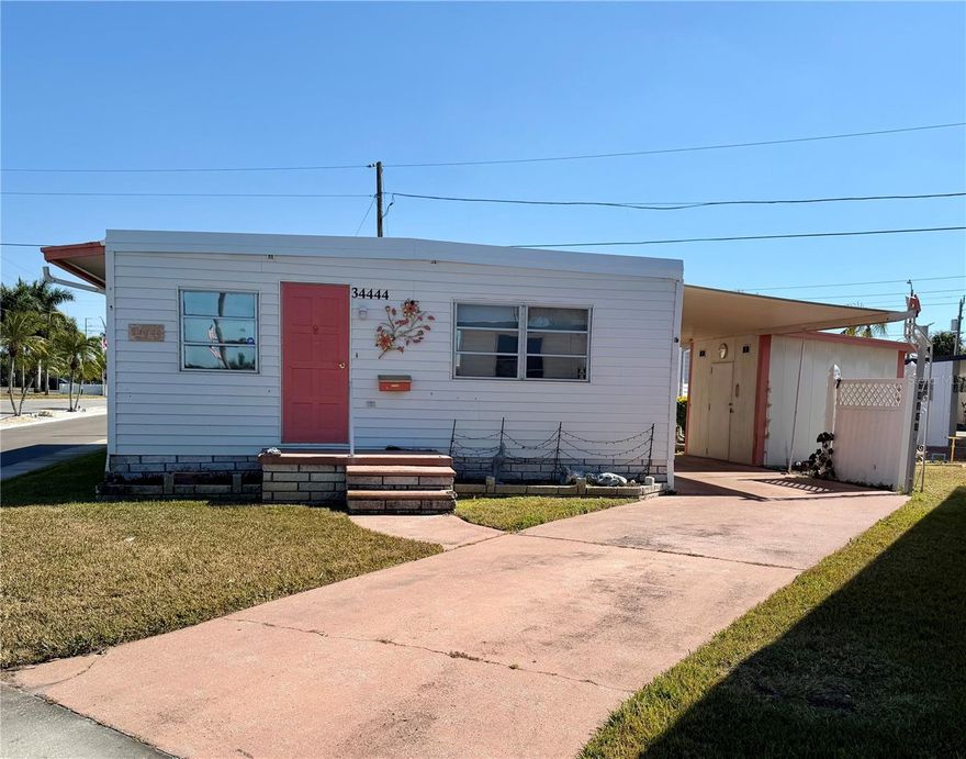 Move-in ready double-wide mobile home offering 2 bedrooms and 2 full baths, ready for you to update to your taste. Home comes fully furnished, turn-key, only personal items will be removed. New roof in 2025! HVAC 2017 The large primary suite includes a walk-in closet, added storage in the en-suite bath, and double sinks. Generously sized bedrooms with excellent storage. Extended driveway fits three vehicles.
Sunset Palms is 1 of Pinellas County‘s best kept secret in my opinion, very inexpensive living at only $210 per month which includes all the amenities one could want; WATER/SEWER/TRASH, owned clubhouse, escrows are fully funded, beautiful heated pool and spa, fitness center, library, shuffleboard, billiard table, and a small lake at the back of the park, laundry room, and your very own private entrance to the super Walmart… On foot, bicycle or golf cart… Etc., etc. This location is close to churches, shopping, restaurants, approx 20-30 minutes to the beach or Tampa Int’l Airport. Jump on I-275 to Tampa, Sarasota, etc.