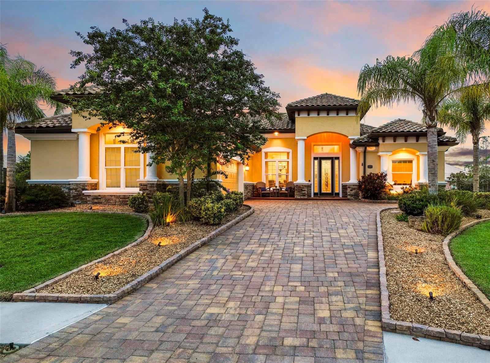 NEW LISTING in Palm Coast Plantation! Custom Skyway Builders Home with Quality Details Throughout. Truly Move-In Ready.
Located on a peaceful cul-de-sac, this residence offers both pond and preserve views, creating a tranquil oasis with breathtaking scenery at every turn. Thoughtfully designed with exquisite woodwork and soaring ceilings, the home exudes elegance and warmth. Natural light flows through every corner, enhancing the expansive floor plan and showcasing high-end finishes like elegant tile flooring and granite countertops. The gourmet kitchen, featuring top-of-the-line appliances and a charming breakfast nook, is perfect for entertaining. Step into the master suite, a true sanctuary with direct pool access, a luxurious en-suite bathroom with dual vanities, a walk-in shower, and a whirlpool soaking tub. Outside, the solar-heated pool and screened lanai overlook a serene pond, surrounded by lush landscaping for ultimate privacy and natural beauty. Palm Coast Plantation offers a host of resort-style amenities: a 24-hour fitness room, a spacious clubhouse, RV/boat storage, a grand 2,000 sq. ft. clubhouse with an adult game room, a community pool and spa, pickleball, tennis, basketball, bocce, shuffleboard, horseshoe pits, and a playground for family fun. This home is a rare find, combining luxury, privacy, and a vibrant community lifestyle. Don’t miss the chance to make it yours!
