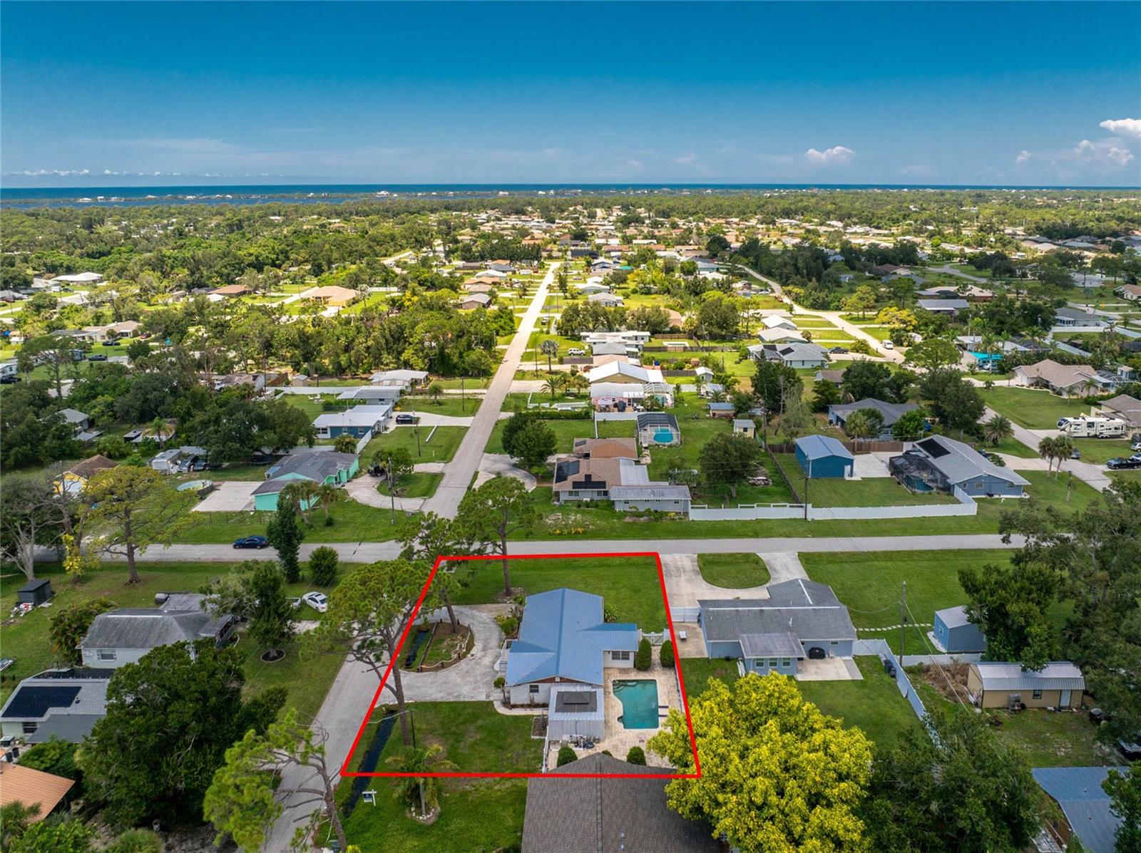 Have Your Morning Coffee on Dearborn, Spend The Afternoon Lounging in the Pool, and then Enjoy Sunset on Manasota Key Beach! This charming North Englewood 2 bedroom, 1.5 bath, 2 car garage pool home is located on an oversized lot in the X flood zone and is less than 1.5 miles from Historic Dearborn Street and 5 miles from Manasota Key allowing you to enjoy the best of everything this small coastal town has to offer. A spacious circular driveway, durable 2024 metal roof, and charming white brick exterior create a welcoming first impression. Step inside and you’ll find pine tongue and groove ceilings and walls that fill the living and family rooms with character, giving the home a nostalgic Old Florida feel. The family room has a beautiful stone propane fireplace, creating the perfect spot to gather on cooler evenings. The galley kitchen offers ample cabinetry and generous countertop space, making it both functional and inviting for everyday cooking or entertaining. The spacious master bedroom includes a walk-in closet and private half bath for added comfort, and an additional guest bedroom provides plenty of room for family or visitors. The full bath features a tiled step-in shower. Outside, the backyard feels like your own retreat with a tin-roofed gazebo and lattice enclosure that provides a charming covered space for relaxing or dining outdoors. Just beyond, the open pavered pool deck surrounds a large pool with a waterfall feature surrounded by privacy fencing, where you can spend sunny days relaxing or hosting fun gatherings with family and friends. Conveniently located in North Englewood, this home puts you close to everything. Enjoy Historic Dearborn Street with its charming shops, local restaurants, and seasonal farmers market, or spend a day at Englewood Beach with its popular tiki bars and live music. Nearby you will also find public boat ramps and kayak launches, golf courses, pickleball and tennis courts, and several scenic parks. A short drive takes you to the new Wellen Park area, home to the Atlanta Braves Spring Training Facility along with great dining, shopping, and entertainment. Whether you are searching for a personal getaway or an investment opportunity, this property offers the perfect combination of location and lifestyle. Schedule your showing today.