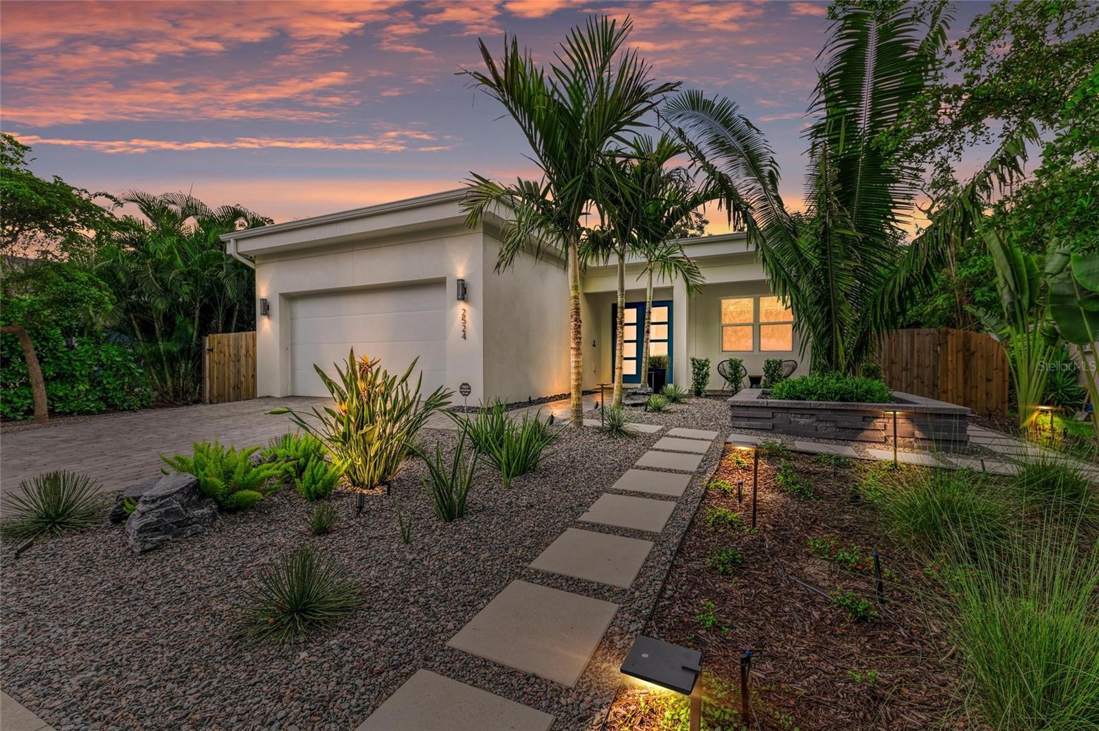 Nestled in the coveted Arlington Park neighborhood, this custom-designed home seamlessly blends modern elegance with premium upgrades. The open-concept layout centers around a stunning great room and a state-of-the-art modern kitchen, featuring sleek Monogram appliances, updated pendant lighting, and ample space for entertaining. Boasting 3 bedrooms, 2.5 baths, a den, and a 2-car garage, this residence offers 2,205 SqFt of heated living space and a total area of 2,926 SqFt. Recently refreshed with new interior/exterior paint, new gutters, a $50,000 professional landscaping package, outdoor lighting, security cameras, and a 6-ft privacy fence, it creates a tranquil, low-maintenance retreat. Luxurious interiors include Carrier AC, Kohler fixtures, a smart mirror in the primary bath, custom closets, smart blinds in living/dining areas, and custom window treatments throughout. Enhanced with dimmable lighting, wallpaper accents, and built-in speakers in the living room, primary suite, and lanai, this home exudes sophistication. Conveniently located near Arlington Park’s aquatic center, trails, and tennis courts, and just minutes from downtown Sarasota, Sarasota Memorial Hospital, shopping, dining, cultural venues, and Siesta Key Beach.Pool design is available
