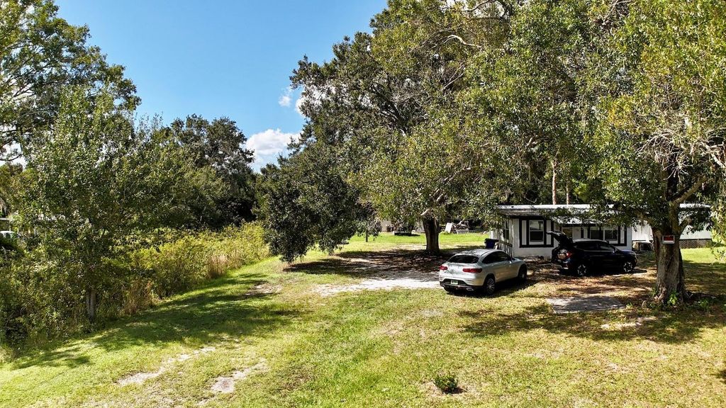 Photo of 9 Palm Haven Drive, Lake Placid, FL 33852 (MLS # OM711780)