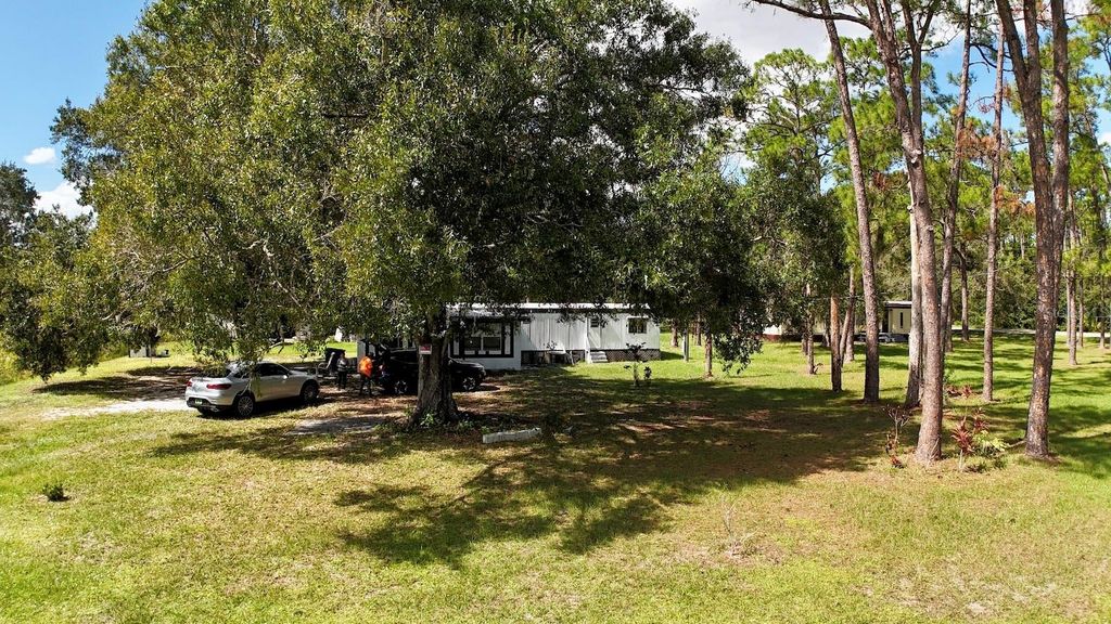 Photo of 9 Palm Haven Drive, Lake Placid, FL 33852 (MLS # OM711780)