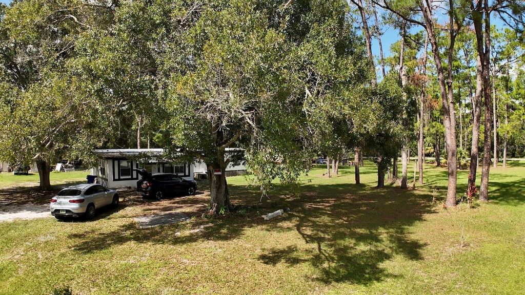 Photo of 9 Palm Haven Drive, Lake Placid, FL 33852 (MLS # OM711780)