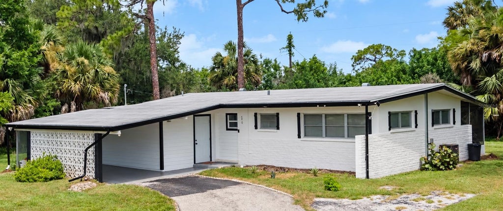 Photo of 340 Timbruce Lane NW, Port Charlotte, FL 33952 (MLS # D6148465)