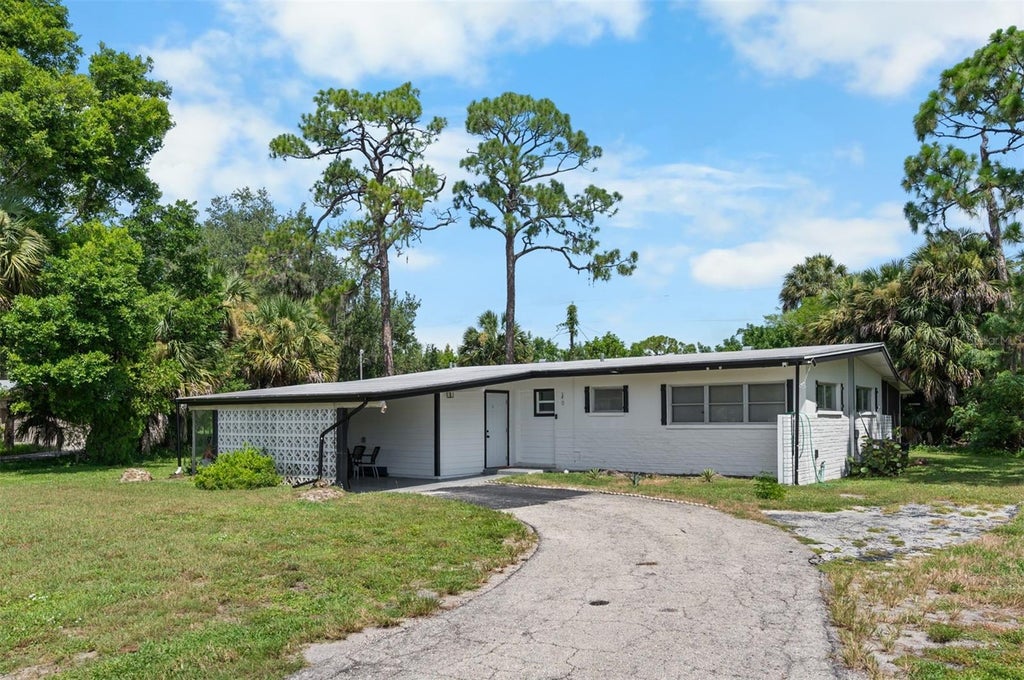 Photo of 340 Timbruce Lane NW, Port Charlotte, FL 33952 (MLS # D6148465)
