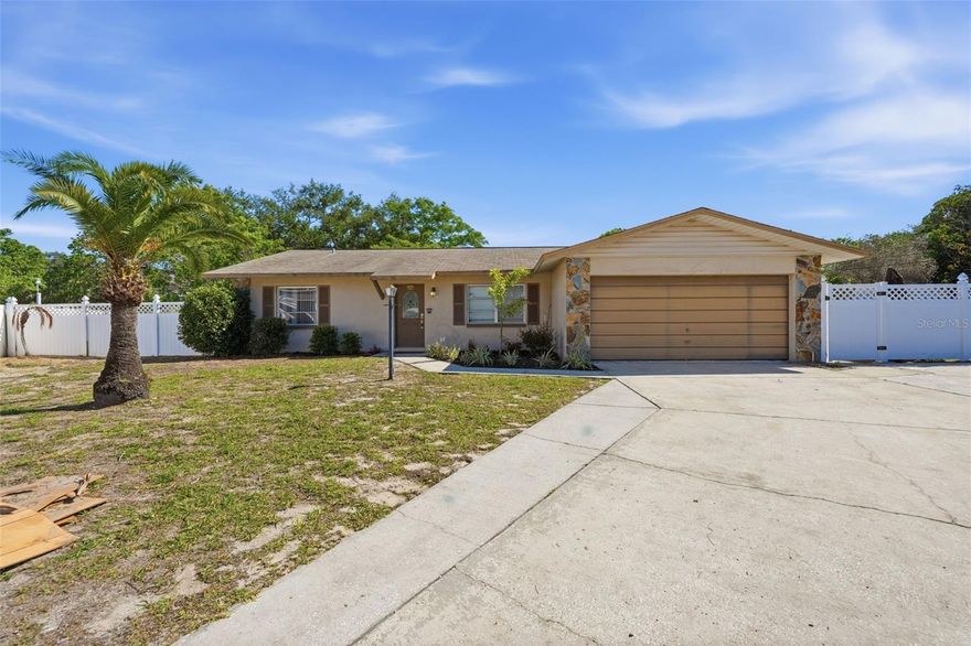 Welcome to this 3-bedroom, 2-bath single-story pool home located on a quiet cul-de-sac in the Golden Gateway Homes community of Tarpon Springs. Situated on a spacious lot, this property offers a functional layout with multiple living and dining areas, providing flexibility for everyday living and entertaining. The home features a central kitchen with dining space that opens to the main living areas, creating a natural flow throughout. The primary bedroom includes an en-suite bathroom, while the additional bedrooms offer comfortable accommodations for family or guests. A one-car garage adds convenience and storage. Step outside to enjoy your private in-ground pool and expansive backyard—perfect for relaxing or hosting gatherings. The screened-in patio provides a covered outdoor space to enjoy Florida living year-round while overlooking the pool area. Constructed with a slab foundation, stucco exterior, and shingle roof, this single-family home is connected to public sewer and offers a standard HVAC system. A new roof will be installed prior to closing, adding value and peace of mind for the next owner. Located just minutes from Downtown Tarpon Springs and the famous Sponge Docks, this home offers convenient access to local dining, shopping, and coastal attractions. This property presents a great opportunity for buyers looking to personalize a home in a desirable location with strong potential. * New roof to be installed prior to closing once under contract and lifetime limited warranty to be transferred to new owner