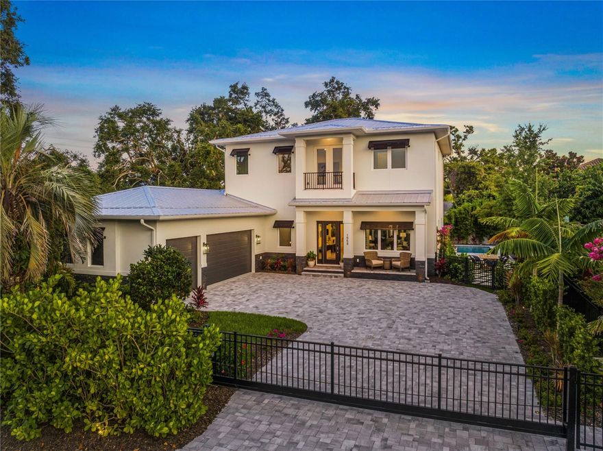 Welcome to 1954 Goldenrod Street, a stunning newly constructed residence located in the highly coveted West of Trail neighborhood. Thoughtfully upgraded and meticulously redesigned, this home embodies modern luxury and comfort at every turn. Behind a newly added front gate, you'll find a residence that now features an elevator system, custom closets, lush landscaping, and a completely reimagined backyard oasis — perfect for relaxing or entertaining in style. The backyard oasis comes equipped with landscape lighting, pavers and turf, an outdoor kitchen, a pool with a sun shelf, and several designated sitting areas, creating a space that can be enjoyed all year long. Offered furnished with interiors curated by a professional designer, this home is both comfortable and warm. Soaring ceilings, expansive living spaces, and abundant natural light define this luxury home. The primary suite is conveniently located on the main floor, providing a private retreat, while three additional bedrooms and bathrooms upstairs offer both privacy and balance. A spacious bonus room on the second level adds versatility — ideal for a media room, game room, or any combination that can be imagined. Beautiful engineered hardwood flooring flows throughout most of the home, complimenting the chef-inspired kitchen, complete with Viking appliances and natural gas for preparing meals for both friends and family. A dedicated office, laundry room, walk-in pantry and three car garage complete the thoughtful layout of this remarkable residence. Location is key, and this home provides ample opportunity to enjoy all that the best of Sarasota has to offer. With close proximity to downtown Sarasota, Southside, and Siesta Key, shopping, dining, and the ultimate Sarasota lifestyle are at your fingertips. Finally, this home sits in the coveted Southside School District, rounding out this brilliant residence and making it truly a must-see.