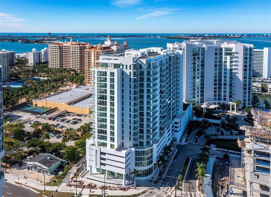 One or more photo(s) has been virtually staged. This brand new Bayso luxury condominium stands perfectly positioned in the heart of downtown Sarasota. This well-appointed, 19th-floor penthouse offers expansive western and southwestern views of the water and city skyline. This home captures contemporary style with a perfect blend of modern finishes and calming appeal. With 3,186 square feet of living area including three bedrooms, three and a half bathrooms, this has it all. The open concept floor plan seamlessly connects common spaces with ensuite accommodations. A spacious living area with soaring 11’ ceilings and dramatic 10’ floor-to-ceiling impact rated windows sets the tone with a spectacular first impression. Delight in quiet relaxation or gathering with guests on the open terrace highlighted by a sleek glass railing with gorgeous views of the water, skyline, and sunsets. Enjoy the expansive eat-in European-inspired contemporary kitchen with a dining space, breakfast bar, glass door wine fridge, butler’s pantry, custom wood cabinets, two dishwashers, Gen air stainless-steel appliances, and quartz countertops. The full-size laundry room off the kitchen includes Whirlpool washer and dryer, a wash tub, and loads of storage. Spectacular views of the bay continue in the owner’s suite with direct access onto the private terrace. The owner’s suite also features two large walk-in closets, a double vanity, a large soaking tub, and an oversized walk-in shower. At the other end of the penthouse, two guest rooms with en-suite baths afford privacy throughout this home. Bayso Sarasota offers a lifestyle enhanced by legendary services and desirable amenities including: 24-hour front desk attendants, onsite property management, a beautiful club lounge with a catering kitchen, a state-of-the-art fitness center and movement studio, and a private conference room including common glass enclosed workstations for private use. Residents and guests will enjoy the elevated resort style pool and spa, a community recreation area with a pergola-covered grilling station, a second catering kitchen, and a private dog park with a pet water fountain. The ideal location and stellar views simply elevate the entire appeal of Bayso living. This home includes two deeded parking spaces, extra owner humidity-controlled storage, and a separate bicycle storage area. Strolling on the waterfront boardwalk, exploring the diverse cuisine, or attending the cultural event centered in downtown Sarasota makes the Bayso a destination, as well as home.
