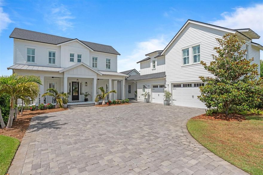 ***BACK-UP OFFERS WELCOMED*** Your Dream Home awaits !!! A perfect blend of luxury and timeless Florida charm, nestled in the vibrant heart of OAKLAND PARK. This beautifully crafted WATERFRONT residence offers an exceptional lifestyle for those who love to entertain, relax, and enjoy nature in style. Step inside to an airy, open-concept layout filled with natural light, elegant wood-look tile floors, and thoughtfully designed spaces that flow seamlessly from indoors to out. The expansive 39X13 screened porch, complete with an 8x5 four-panel slider, invites you to unwind by the lake while enjoying glowing sunsets and gentle breezes. Gather around the firepit or host memorable evenings on the paver patio. This home was made for connection. From the charming front porch, French doors lead to versatile rooms perfect for a home office, guest suite, or hobby space. At the heart of the home is a CHEF'S KITCHEN designed to impress, featuring a large center island, 6-burner natural gas range, 2 ovens, with pot filler, expansive cabinetry throughout, stainless steel farmhouse sink, under-counter microwave, ice maker, and a sleek side-by-side fridge/freezer. The spacious butler pantry ensures everything has its place. The living area is stunning with coastal-inspired shiplap walls, a custom wet bar with glass cabinetry, and stylish finishes throughout. Tucked away for ultimate privacy, the luxurious OWNER'S SUITE offers sweeping lake views, private porch access, spa inspired bath with a freestanding soaking tub, seamless glass rain shower, and a custom walk-in closet. UPSTAIRS, you’ll find a generous loft for movie nights or play space, along with three well-appointed bedrooms and two full bathrooms. A separate brick-paved courtyard leads to a breezeway and the oversized three-car garage. Above it, a 907-square-foot garage apartment with kitchenette, walk-in closet and full size bath, ideal for in-laws, guests, and family. This home is part of a certified green community featuring waterfront walking trails, a fishing pier, two resort-style pools, lush parks, a clubhouse, and direct access to the scenic West Orange Trail. All this—just a short golf cart ride from historic downtown Winter Garden, where you can enjoy vibrant dining, shopping, and year-round events at Plant Street Market and much more!!!