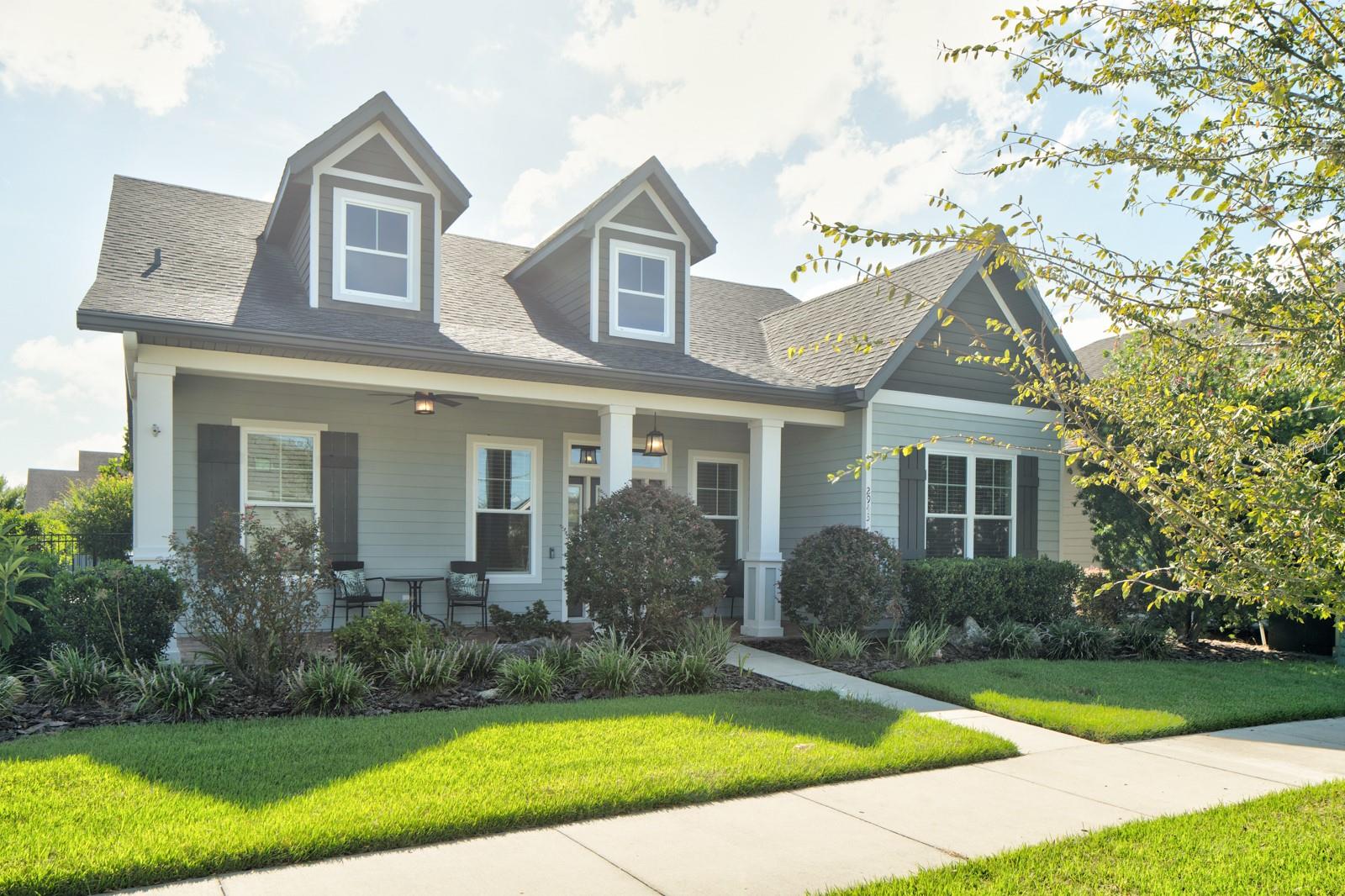 Welcome to this exceptional home built by Gainesville’s premier green builder, Tommy Williams. This popular "Kingston" model, built in 2020, blends energy efficiency with high-end design, offering both beauty and sustainability in the heart of Oakmont.
From the moment you arrive, you'll notice the charming front porch and tasteful curb appeal. Step inside to soaring ceilings and a spacious open layout that feels even larger than the square footage suggests. The home is filled with upgrades, including wood-look plank tile flooring that runs seamlessly through all living spaces—kitchen, dining, great room, bedrooms, bathrooms, and laundry.
The kitchen is a showstopper with rich maple cabinetry, granite countertops, stainless steel appliances, an eating bar, and a custom tile backsplash. The great room features a tray ceiling that adds architectural interest and elegance. Throughout the home, you'll find custom fans, blinds, and stylish decor colors that enhance every space.
The luxurious master retreat offers a peaceful escape with a dual vanity, walk-in closet, and a European-style entry to the master shower. A huge walk-in pantry and thoughtful storage spaces add to the home's functionality.
French doors lead to a covered and screened lanai that opens to a private backyard oasis, complete with paver patio, fire pit, and a fully fenced yard—perfect for relaxing or entertaining. A detached two-car garage provides ample space and convenience.
As a Solar Standard home, this property boasts incredibly low utility bills through Clay Electric. Living in Oakmont means enjoying resort-style amenities including a clubhouse, zero-entry pool, fitness center, amphitheater, tennis courts, and more.
This is not just a home—it's a lifestyle. Don’t miss your chance to own one of the most desirable models in one of Gainesville’s most vibrant communities.