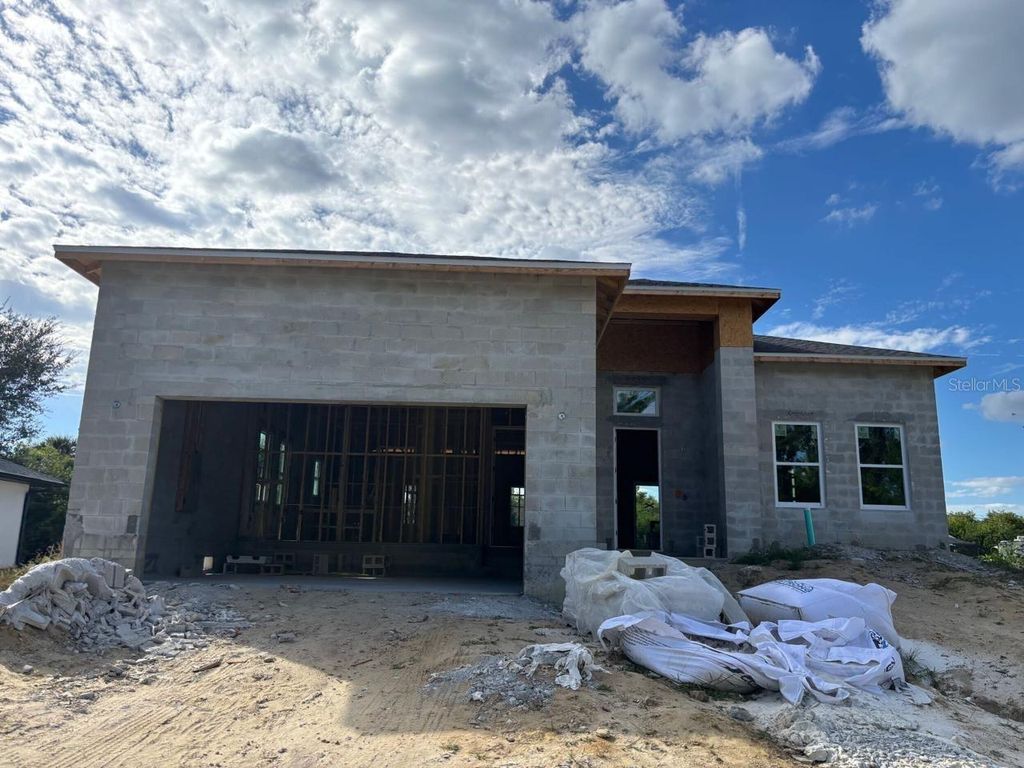 Photo of 310 Millport Street NW, Port Charlotte, FL 33948 (MLS # O6359819)