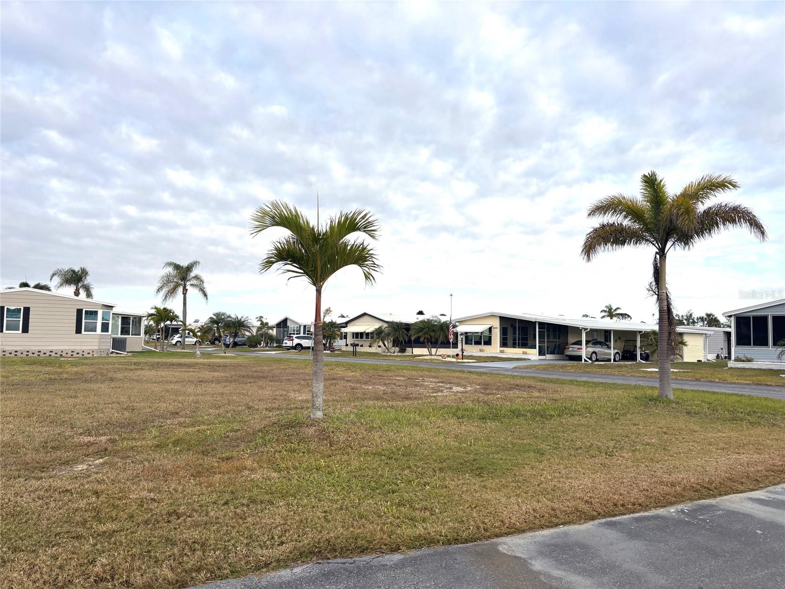 Vacant lot in a vibrant 55+ community! La Casa offers the ultimate Florida lifestyle. We have 974 homes nestled among a variety of native trees with spacious common grounds surrounding our eight lakes. Located between Sarasota and Fort Myers, this is a boater's dream with access to the Gulf of Mexico. It is convenient for shopping, sightseeing, golfing, fishing, and boating, as well as all the culture and elegance the Southwest Florida area is noted for. La Casa may have the best pools in the area. Our crown jewel is an extremely large, 40 X 60-foot swimming pool that is kept at a perfect 87 degrees. Our smaller 20 x 40 pool is quietly nestled between the clubhouse and the Activity Building. Both pools have adjacent hot tubs which are ideal for soaking muscles that are tired from golfing or tennis. Wireless Internet (Wi-Fi) is available at the Clubhouse, Activity Building, and Recreation Hall area where these pools & spas are located, so you can catch some rays while you catch up on your email! Sound enticing? Come for a visit to this self-contained oasis and see for yourself why La Casa is the ultimate destination for both snowbirds and year-round residents!