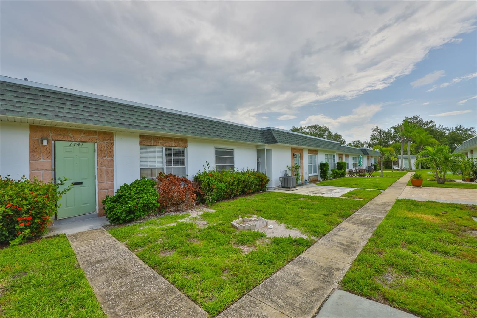 Welcome to Tyrone Villas! This vibrant 55+ community is perfectly situated in St. Petersburg, just a stone's throw from the stunning Gulf beaches, the Bay Pines VA Hospital, both Tampa International and St. Petersburg/Clearwater airports. It is surrounded by fantastic shopping options and restaurants. This charming 2-bedroom, 1-bath condo is priced to sell and ready for its next owner! Roof is new 2023. With low maintenance fees and an ideal location, it's the perfect spot to relax and enjoy all that St. Petersburg has to offer. This unit includes a single carport to protect your vehicle from the elements and washer/dryer hookup is in storage area. Located just 10 minutes from the Gulf beaches, this property did not experience any flooding, providing peace of mind and protecting your investment. No flood insurance required. The affordable monthly maintenance fee covers water, trash, sewer, roof, and exterior maintenance for added convenience. Residents of this friendly close-knit community can enjoy amenities such as a solar heated community pool, shuffleboard courts, and freshly painted clubhouse for social gatherings and community meetings. Don't miss out on this incredible opportunity!