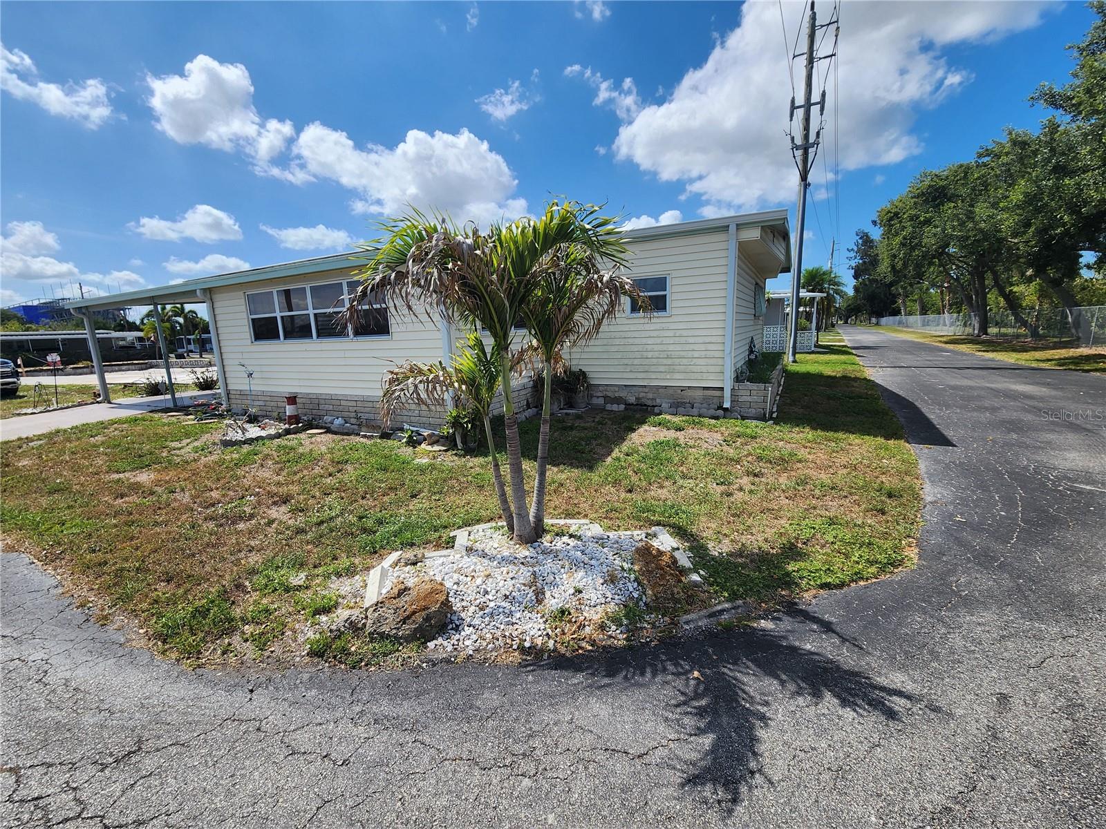 Nestled in the welcoming Chateau Village, a 55+ active community with No lot rent and a Low maintenance fee, this charming 2-bedroom, 2-bath mobile home sits gracefully on a desirable corner lot. The home is furnished, ready for immediate enjoyment. With its durable vinyl siding and roof-over design, it promises both comfort and low upkeep. Upgrades include: Roof in 2016, Windows 2013, A/C 2023 and Tenting 2024. The $220 monthly maintenance fee is refreshingly affordable and includes water, sewer, trash, cable, internet, Manager, lawn mowing, and access to the heated pool and clubhouse—perfect for relaxing or socializing. I is located near eating places, shopping, airport and minutes to the beautiful beached. This is a 55+ community. Come for the season or stay all year long.