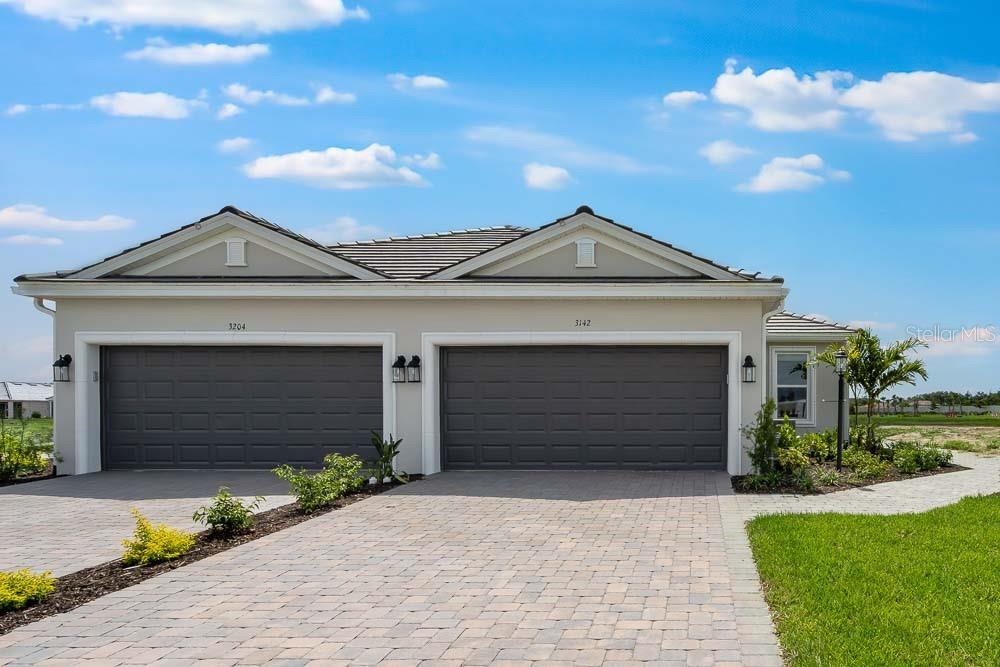 New Construction - Ready Now! Built by Taylor Morrison, America's Most Trusted Homebuilder. Welcome to the Ibis at 3142 Torta Court in Esplanade at Azario Lakewood Ranch blending comfort, flexibility, and style in a thoughtfully designed Twin Villa layout. Offering 1,533 square feet, this home features 2 bedrooms, 2 bathrooms, a flex space, and a 2-car garage—all arranged to maximize flow and function. The private primary suite is a serene retreat with a spacious walk-in closet, dual vanities, a large shower, and a private water closet. At the front of the home, a secondary bedroom with attached bath and a versatile flex room give guests or hobbies their own space. The heart of the home brings everyone together with a bright great room, designer kitchen, and separate dining area—all visible the moment you step through the side entry. A screened lanai extends the living space outdoors, perfect for relaxing or entertaining. At Esplanade at Azario Lakewood Ranch, every day feels like a getaway. Enjoy a year-round vacation lifestyle with access to resort-style amenities that offer everything from fitness and fun to rest and rejuvenation. With an on-site lifestyle manager to help you make the most of it all, the experience rivals a world-class resort—without ever having to pack a bag. Additional Highlights Include: Study and Extended Screened in Covered Patio. Photos are for Representative Purposes Only. MLS#O6314457