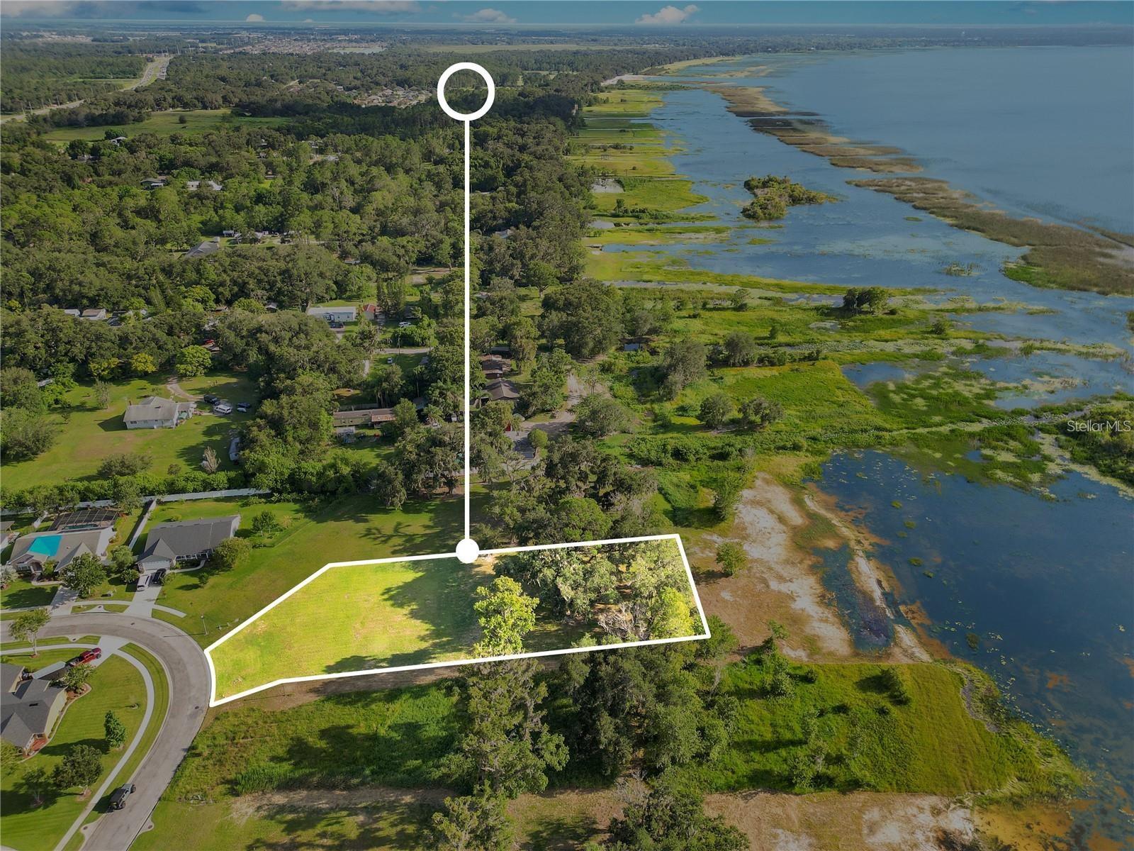 Waterfront Living in a Gated Community – Minutes from Lake Nona & Orlando International Airport!
Nestled in one of Osceola County’s most sought-after gated communities, this prime .8-acre waterfront lot offers the perfect blend of privacy, natural beauty, and convenience. Wake up to breathtaking views of East Lake Toho, where sunrises paint the sky and tranquil waters invite you to fish, boat, or simply unwind in your own personal oasis.
A majestic oak hammock at the rear of the property enhances the serene ambiance, providing shade and seclusion for your future dream home. With ample space to design your custom residence, this lot offers endless possibilities to create a sanctuary tailored to your lifestyle.
Enjoy peaceful lakeside living while being just minutes from Lake Nona’s top-rated dining, shopping, and medical facilities, as well as Orlando International Airport, major highways, and world-class attractions. Spend your evenings taking in stunning sunset views from your own backyard or the community dock, where you can cast a line and relax by the water.
Seize this rare opportunity to build your dream home in an exclusive community where luxury meets nature. Your waterfront paradise awaits!