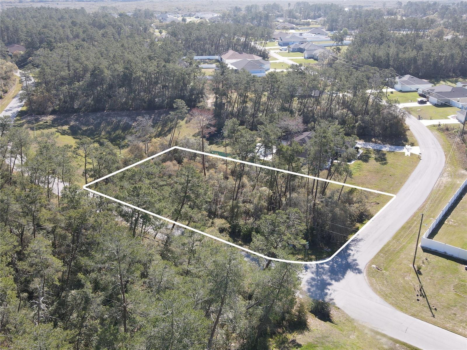 Nestled within the neighborhood of Ocala Waterway Estates in a quickly growing area of Ocala, this vacant lot has a great location. Offering a large corner lot, this parcel is spacious with nearly a half-an-acre of space. The lot has only one direct neighbor and a retention area on the other side that allows for plenty of privacy to any future home you may choose to build. This area of Ocala is quickly growing with many new homes in the area and is highly convenient to both Highway 200 and I-75. A variety of shopping, dining, event, and medical options are nearby, and this property is zoned for Marion Oaks Elementary School, Liberty Middle School, and West Port High School. If you’re ready to build the home of your dreams, this lot is a wonderful option to consider!