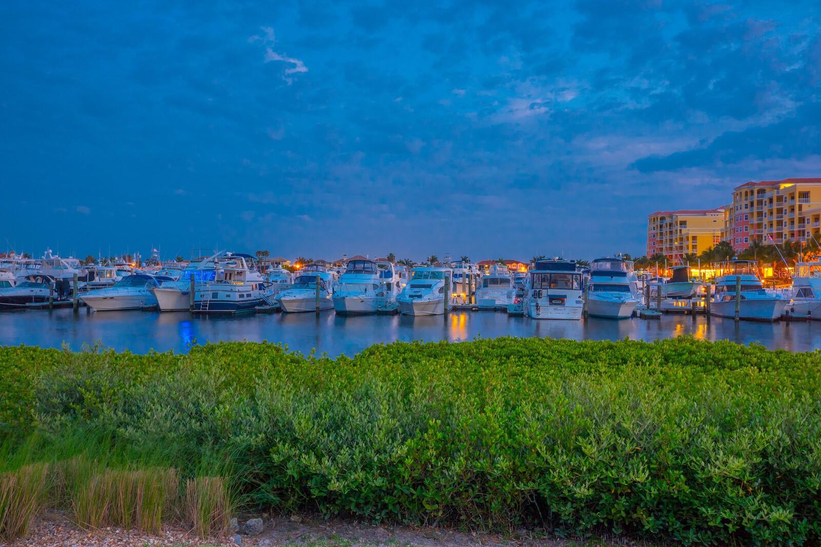 Step into a world of elegance, comfort, and breathtaking water views in this rarely available 2-bedroom, 2-bathroom residence located on the highly sought-after east side of the desirable Bel Mare condominium in Riviera Dunes. Perfectly positioned to overlook the Riviera Dunes Marina and the serene Manatee River, this beautiful home offers an unmatched lifestyle in a secure, gated community. The heart of the home is the chef-inspired kitchen, featuring custom cabinetry, sleek quartz countertops, a pantry, and top-of-the-line appliances including a Sub-Zero refrigerator and integrated dishwasher panels for a seamless, designer look. Whether you're preparing an intimate dinner or entertaining guests, this kitchen with bar seating, will not disappoint. Enjoy sunrises over the marina, dolphins playing in the water, and yachts gently sailing by, all from the comfort of your oversized, end-unit, private balcony with entry from the great room and the primary suite. In the evenings, watch the full moon cast a silver glow over the water, a view few can claim as their own. The primary bedroom is your personal retreat, offering stunning water views, direct balcony access, two generous walk-in closets with exceptional built-in cabinetry, and a luxurious en-suite bathroom with dual vanities, a large soaking tub, and a separate shower. The guest bedroom features a cleverly designed walk-in “cloffice” (closet + office) with custom built-ins—ideal for remote work or storage.This end unit, sun drenched residence offers impeccable style and taste, allowing you to move in quickly and start enjoying the Florida lifestyle immediately. Enjoy remote control blinds, luxury vinyl and porcelain tile flooring, new AC and new Hot Water Heater. Bel Mare is located within the highly desirable, master-planned community of Riviera Dunes. Residents here experience a luxury lifestyle, enhanced by exclusive access to the Palmetto Marriott Resort & Spa and the Riviera Dunes Beach Club, not to mention, just steps to the separate Marina where boat slips may be purchased. There is an array of impressive amenities, including three salt water pools, an infinity-edge pool with hot tubs and private cabanas, fitness center, tennis/pickleball courts, minitature golf, volley ball and basketball, scenic walking trails, dog-friendly areas, outdoor chess and checkers, a waterfront café, and MORE! Your guests will have access to well-furnished guest accommodations onsite. Additional Bel Mare highlights include a private movie theater, billiards room, and a stylish social lounge perfect for hosting events. Other conveniences feature secure, climate-controlled storage, a deeded covered parking spot under the building, and parking for visitors! You have easy access to a vibrant waterfront dining scene with live entertainment, right next to the marina. Ideally located close to the sandy beaches of the Gulf of Mexico, Anna Maria Island, Emerson Point Preserve, the Bradenton Riverwalk, and top-tier healthcare, this residence also offers easy access to Sarasota, St. Petersburg, Tampa, and three major airports via nearby I-75 and I-275. Don't miss this opportunity to live the resort lifestyle in one of Florida’s most desirable waterfront communities. Schedule your private showing today!