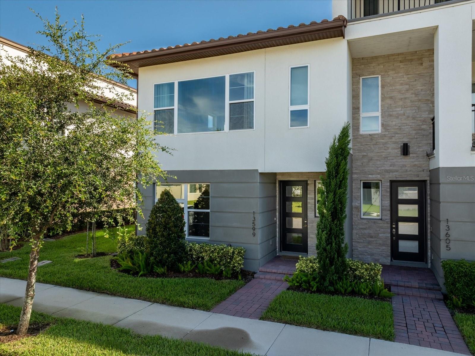 You must see this Rare End Unit Townhome in the highly sought-after Gated Golf Community of Eagle Creek in Lake Nona. The open floor plan, high ceilings, and extra windows create an energizing flow of natural light throughout. Rich colors and lighting enhance its beauty. The spacious primary suite, located off the kitchen, offers a sizable bedroom, luxurious bathroom and oversized walk-in closet. The primary bathroom includes dual vanities and shower. At the center of the home is the Living room, dining area, and gourmet kitchen. This open concept is perfect for everyday living and entertaining. There are two bedrooms on the first floor along with the laundry room. Eagle Creek features a family clubhouse with Fitness Center and Gathering Room. Resort-Style Pool, Tennis Courts, Basketball Courts and Covered Playground. Such a great location with minutes to Lake Nona Medical Center, Orlando International Airport, Hwy 417 and Hwy 528 making easy access to all of Central Florida.