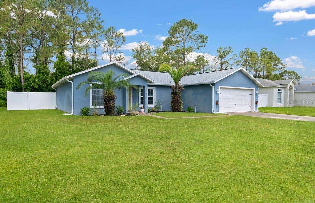 Photo of 54 Pennsylvania Lane, Palm Coast, FL 32164 (MLS # O6428730)