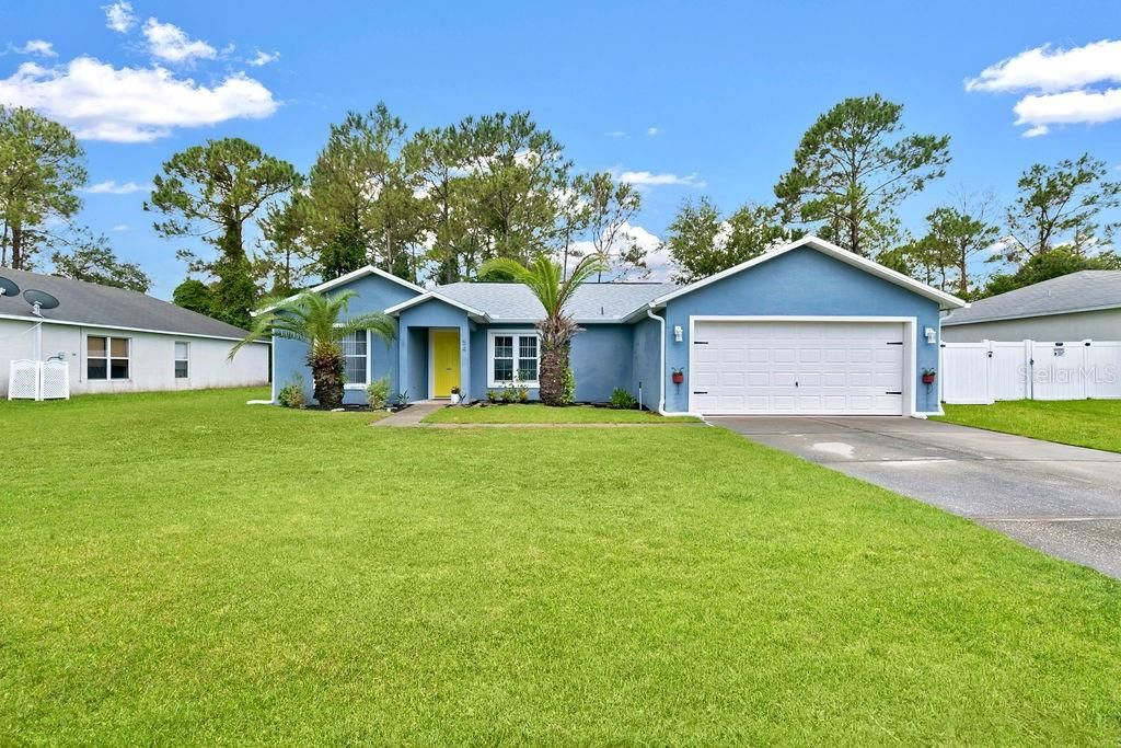Photo of 54 Pennsylvania Lane, Palm Coast, FL 32164 (MLS # O6428730)
