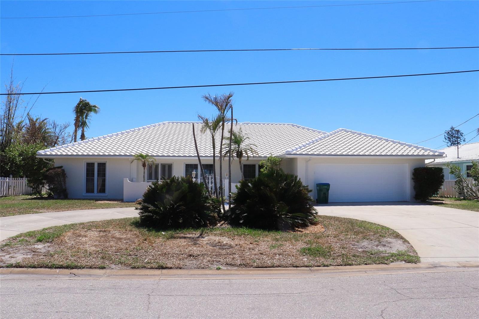 Canal-Front opportunity in Key Royale – Remodel or Build New! Located in the desirable Key Royale community, this 3-bedroom, 2.5-bathroom waterfront home offers a prime opportunity to remodel or build new on a spacious 10,280 Square Feet lot with direct canal access. With a solid seawall and a well-maintained private pool, the property is ready for your vision, whether you choose to renovate the existing 2,211 sq. ft. home or design a brand-new coastal retreat. The 2-car attached garage provides ample storage as well as indoor/outdoor shower, and the one-month minimum rental period makes this an excellent investment opportunity for vacation rental income. Boating enthusiasts will appreciate the deep-water canal access, while the tranquil setting of Key Royale provides the perfect balance of privacy and island living. Whether you're looking for a personal getaway, a lucrative rental property, or the chance to build your dream waterfront home, this property offers endless possibilities in one of Anna Maria Island’s most sought-after locations.