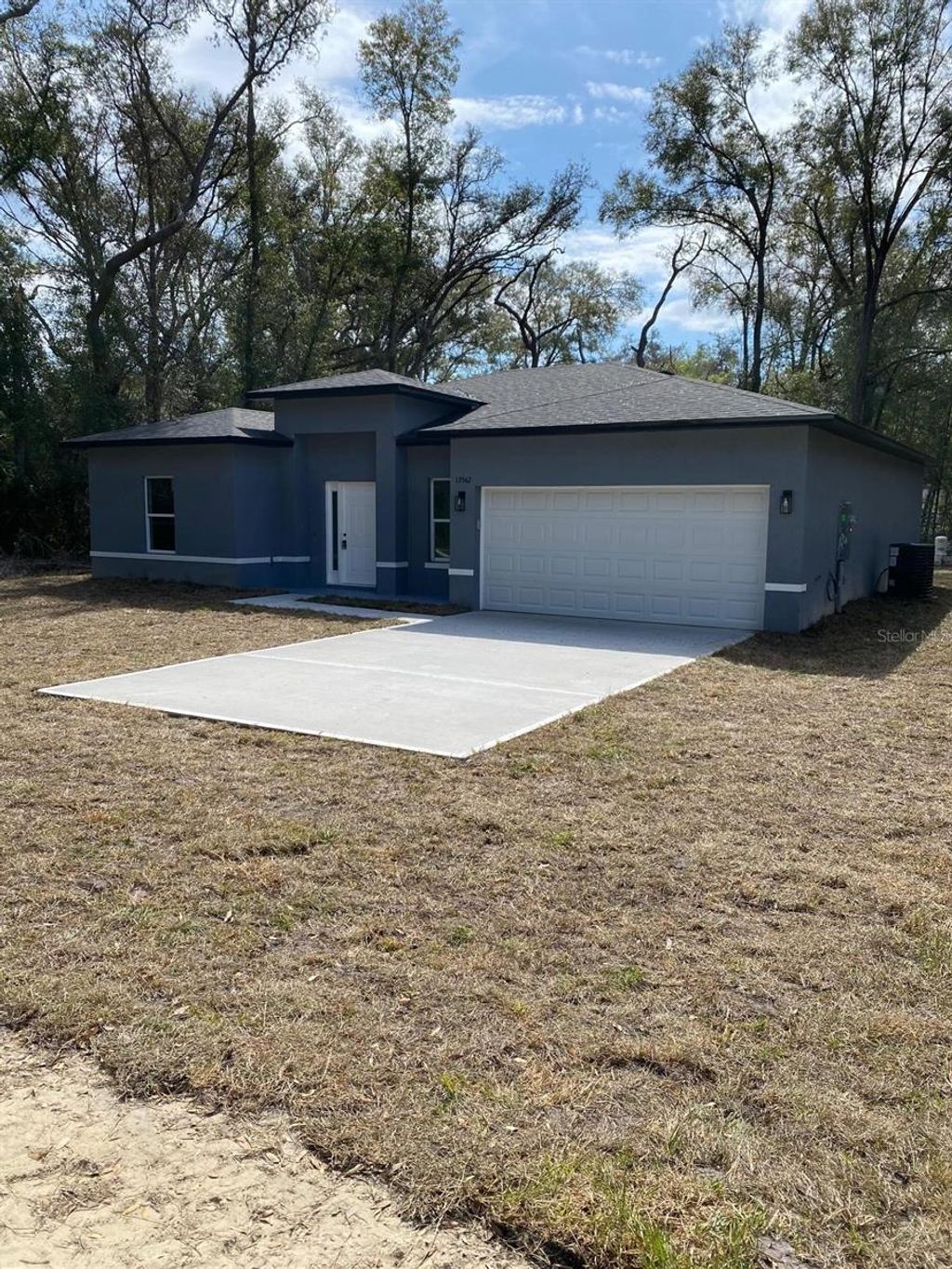 Photo of 13542 SW 114th Place, Dunnellon, FL 34432 (MLS # O6401032)