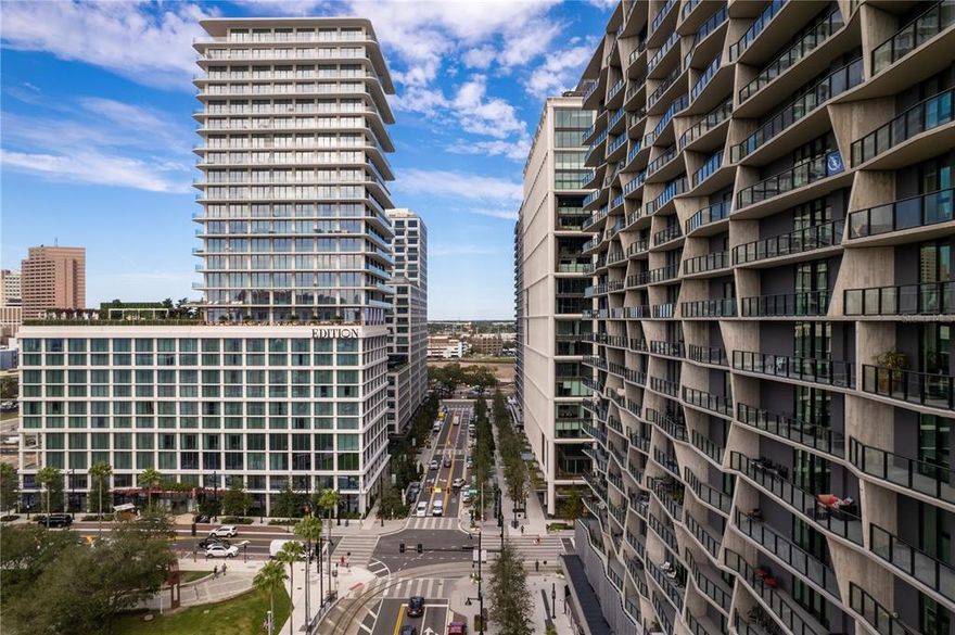 The Residences at The Tampa EDITION embodies luxury as one of only 38 residences, rising elegantly skyward above Tampa’s only five-star hotel, offering the comfort and intimacy of a custom finished home, with all the privileges of being catered to and cared for. This home has the ultimate in indoor-outdoor living. Floor-to-ceiling windows invite panoramic views of Tampa Bay and the downtown skyline, while the outdoors beckon through multiple sliding glass doors that lead to generous wraparound terraces with glass railings. Thoughtfully appointed interiors inspired by Roman and Williams as well as further customization by Charlie Schiller Design blend ease and elegance to create airy, exceptionally inviting spaces with ten-foot ceilings throughout.  Hand finished high polished neutral Venetian plaster warmly washes the walls of the common living areas. High end lighting was added throughout including Apparatus, Urban Electric, and more.  Wide plank 10-inch custom white oak Grato hardwood floors throughout. Polaris White marble kitchen countertops with waterfall island, full height backsplash and ambient cove lighting. Custom white oak Molteni Italian Millwork and powered upper cabinets. Gaggenau Kitchen Appliances including wine cooler and 5-burner gas cooktop. Miele fully venting hood incorporated into cabinetry. Owner’s bath walls and flooring clad with 24”x24” Polaris White marble with corresponding marble mosaic in owner’s bath shower. Double Vanity in Polaris White marble over custom floating Molteni Italian Millwork and under counter ambient lighting. Powder Bath with Venetian plaster walls. Laundry room with Molteni cabinetry, utility sink, Electrolux Washer and Dryer and UV HVAC light filter. 3 parking spaces included and 1 storage unit. Electric vehicle charging stations available. The Tampa EDITION is situated within Water Street Tampa, the first WELL-certified community in the world and along with hotel benefits including a rooftop pool & terrace and access to a full-service spa, residents will enjoy EDITION’s signature approach to world-class food and beverage, which extends to seven in-house dining options, including restaurants overseen by award-winning chefs. A full suite of dedicated services and amenities including a residents-only gym, social kitchen and lounge, and an on-premises lifestyle manager make day-to-day living exquisitely seamless. The utmost in privacy is assured with a private residential drive, valet, entrance, lobby, concierge and elevators dedicated to The Residences. The neighborhood connects city and nature, business and culture as well as work and play in unparalleled access.