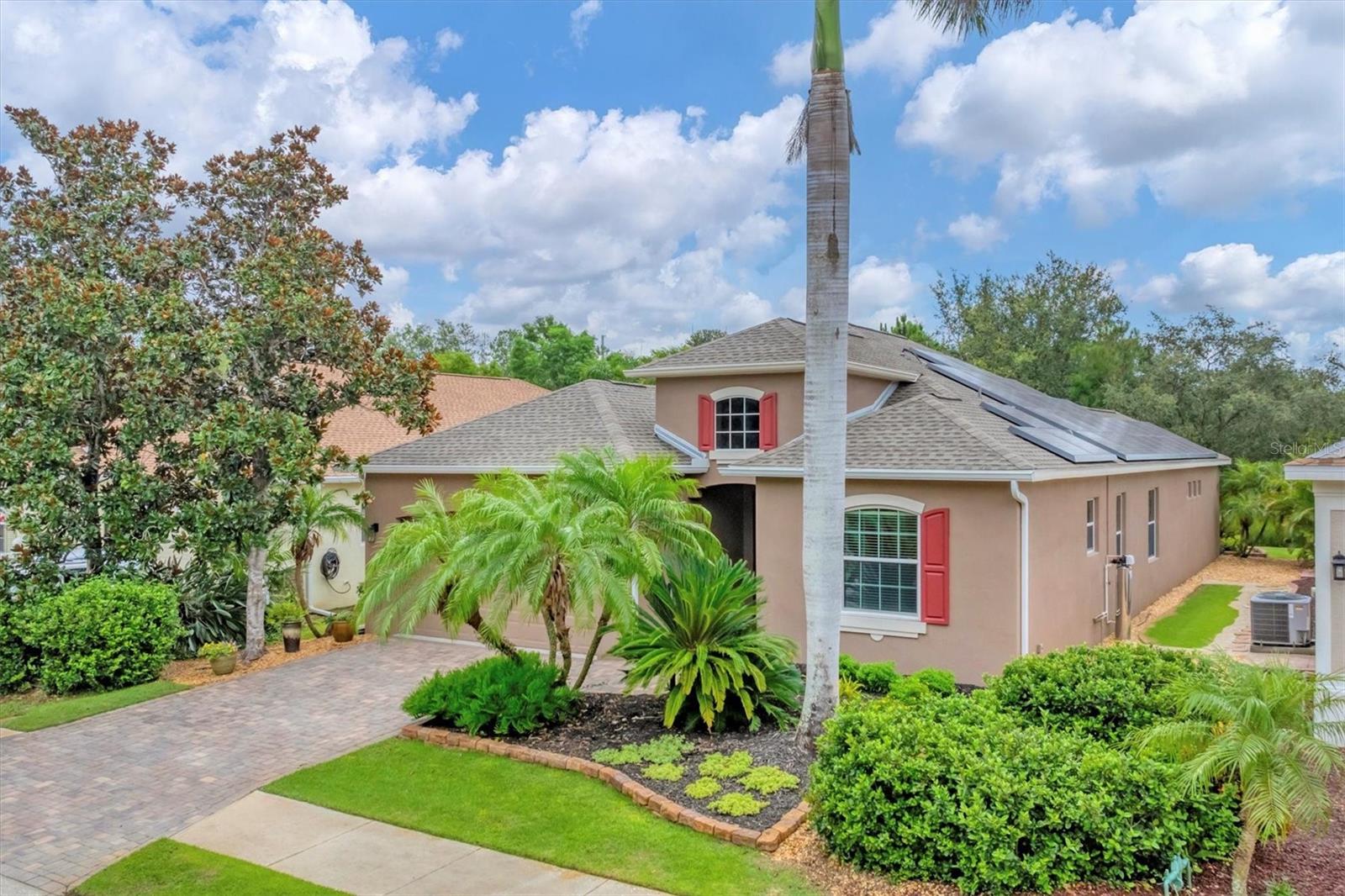 Welcome to this beautifully maintained home, on a quiet cul-de-sac in the sought-after Greenbrook community. Offering a blend of tranquility and convenience, this prime location is just moments from top-rated schools, shopping, dining, and a variety of lifestyle amenities. Enter to discover a tastefully designed interior filled with distinctive features and thoughtful upgrades. The flowing floor plan includes a welcoming living room with a coffered ceiling and ideal wall space for showcasing art, a formal dining area ideal for entertaining and a family room that seamlessly connects to a charming breakfast nook. The well-appointed kitchen offers style and functionality, featuring a central island with quartz countertops, and granite on the cooking surfaces. The family room opens directly onto the lanai and pool area, creating an easy flow for indoor-outdoor living. Designed with privacy in mind, the split-bedroom layout features two guest bedrooms at the front of the home, accompanied by a bright and cheerful secondary bath with a tub/shower combination. The spacious fourth bedroom includes new flooring, its en-suite bath that also serves as a convenient pool bath, a large walk-in closet and a walk-in shower. The welcoming primary suite is tucked in the rear of the home, providing a serene retreat that overlooks the lanai and sparkling saltwater pool. This suite includes a generous walk-in closet and a luxurious en-suite bath with dual sinks, a soaking tub and a newly updated walk-in shower. Additional comfort is provided by a dedicated mini-split air-conditioning system. Go outside to a recently updated lanai adorned with new pavers, where you can unwind with a cocktail or morning coffee. The pool and spa are surrounded by lush landscaping and shaded by elegant drapery—ideal for quiet relaxation and festive gatherings. This home showcases exceptional attention to detail and pride of ownership with a long list of recent upgrades including a new roof, fresh interior paint, Halo water filtration system, new pool heater, smart home technology, new solar system, hybrid water heater, upgraded air conditioner UV light system, new pool bath door, new screens for the pool cage, new garage side door, new refrigerator and dishwasher, increased attic insulation, two new commodes, freshly cleaned and sealed tile grout, three replaced windows, a Powerwall battery backup and Ring security system. Plantation shutters, fans in every room and coffered ceilings further enhance the home's appeal. Living in Greenbrook means enjoying a range of recreational opportunities, including Greenbrook Park and Adventure Park. Residents have access to basketball and sand volleyball courts, soccer and baseball fields, scenic recreational trails, playgrounds and dedicated dog parks. Something for everyone! Don't miss the opportunity to make this exceptional Greenbrook home your own, where comfort, style and convenience come together effortlessly.