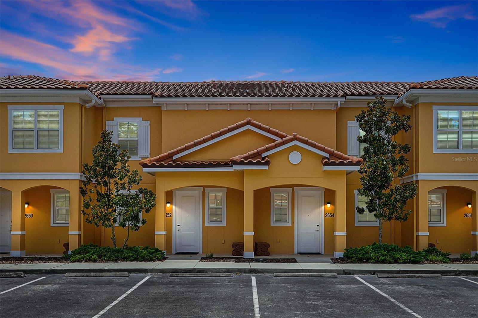 Stunning 2 bedroom 2.5 bath townhome in the very popular gated community of Regal Oaks. Minutes from Walt Disney Resort, restaurants and shopping. Open floor plan main floor with granite counter top kitchen, laundry and powder room. Sliding doors to over sized lanai with heated hot tub. Second floor with 2 ensuite bedrooms and baths. Top of the line amenities with resort style zero entry pool, water slide, pool bar and cabanas. State of the art Clubhouse with restaurant, lounge, games room, fitness center, convenience store and tennis court. Ideal as second home, investment property or a combination of both. Best priced property in the community.