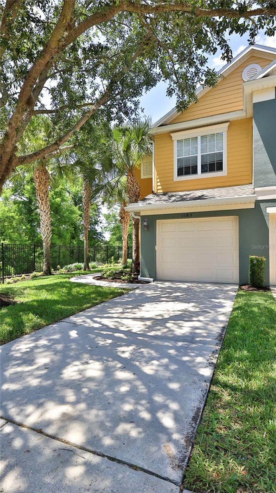 Refined Living - Discover an exceptional 3-bedroom, 2.5-bath luxury townhome in Regency Oaks, where tree-lined streets, mature landscaping, and a welcoming gated entrance create an immediate sense of arrival. Ideally situated as a desirable corner unit, this residence offers added privacy, abundant natural light, and a polished interior designed for comfortable everyday living and effortless entertaining.  Inside, every upgrade has been thoughtfully considered and beautifully curated down to the smallest detail. The heart of the home is the stunning kitchen, featuring crisp white cabinetry, stainless steel appliances, and sprawling quartz countertops that anchor the space while connecting seamlessly to the dining room and great room. Open-concept living is enhanced by abundant natural light, neutral tones, custom lighting fixtures, and ceiling fans throughout, creating a fresh contemporary feel that is both elegant and welcoming. Newer luxury vinyl flooring extends through the main living areas and is paired with high baseboards for a refined finish, while the bathrooms showcase porcelain tile  flooring that look like marble for an added touch of luxury. A multi-slide door opens effortlessly to the covered rear porch, inviting a seamless indoor-to-outdoor lifestyle and offering a peaceful backdrop for relaxing mornings, quiet evenings, or casual entertaining. Regency Oaks community offers the charm of an established community with the ease of a luxury townhome lifestyle. Residents enjoy a carefree lifestyle supported by a generous HOA package that includes water, exterior maintenance, exterior lawn care, access to a sparkling retreat-style pool, pavilion, dog park area, overflow parking, and community mailboxes. It is a setting designed for those who value comfort, convenience, and the beauty of a well-maintained neighborhood. Ideally located in a prime location near SR-417 and I-4, this home offers easy access to work, shopping, dining, entertainment, area attractions, and the beaches, making daily life and weekend plans equally convenient. Nearby destinations include Sanford-Lake Mary shopping and dining, Sanford’s Historic District, and the Lake Monroe RiverWalk and Marina, all of which enhance the appeal of this exceptional location. Your opportunity awaits to Blend elegant finishes, inviting living spaces, and a location convenient to shopping, dining, entertainment, and major commuter routes, this home presents an outstanding opportunity in Sanford. Schedule your personal viewing right away and experience the comfort and style of Regency Oaks for yourself.