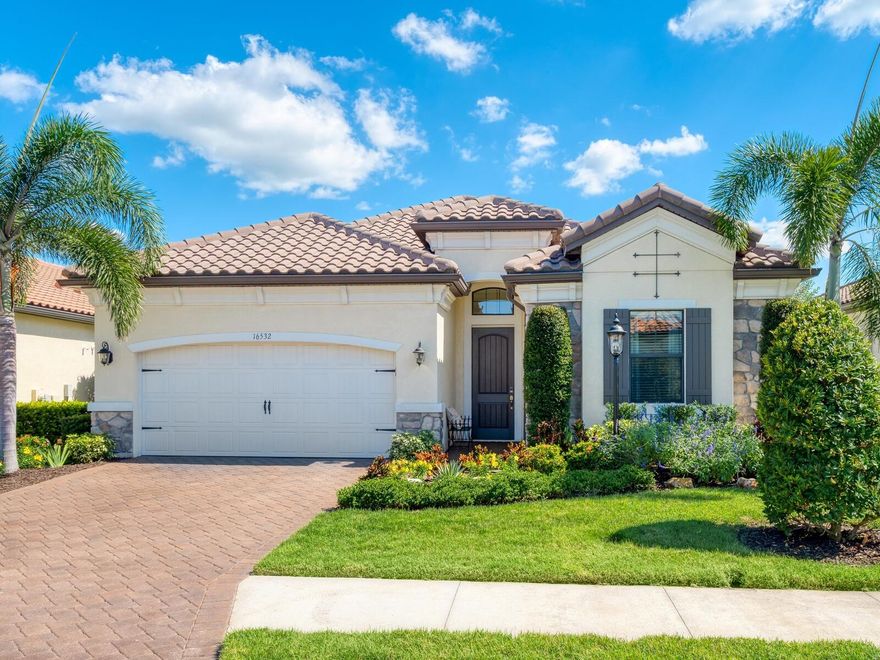 Exquisite and effortlessly stylish, this 4 Bedroom, 3 Bath model-quality home is framed by beautiful landscaping and nestled on a premier home site in Hillside at Country Club East at Lakewood Ranch.  Once inside you will marvel at the fine array of architectural details from the foyer’s coffered ceiling treatment with crown molding to the rich luxury vinyl flooring throughout.  The kitchen is a gourmet dream featuring sleek wood cabinetry with drawers and pullouts, new exquisite hardware, exotic granite counters, granite sink, designer brick backsplash, under cabinet lighting, stainless steel appliances and range hood, chair height island and pantry, all open to the family room making entertaining a breeze.  Family room sliders open to heated Pebble-Tec pool with spa and paver deck featuring outdoor kitchen with hood, storage and refrigerator, the ideal venue for lounging, refreshing and enjoying your spectacular water and vista view.  You will look forward to relaxing each evening to the spacious master suite with two suited closets and a deluxe spa-like bath.  The 4th bedroom with closet can flex as a den/office with double pocket entry doors. Both guest baths offer wood cabinetry, granite counters and designer tile. Other features include cabinets above washer and dryer with laundry sink, epoxy garage floor and storage racks in garage over car area.  Newly painted interior including baseboards and trim. Attractive light fixtures and window treatments throughout.
Walk or bike over to Retreat where you will enjoy resort-style pool, fitness center, clubhouse, grill area and fire pits.  There is even a nearby golf cart access path for your convenience.  Your slice of paradise awaits at Hillside in this number #1 multi-generational community in the country; Lakewood Ranch, conveniently located near A-rated schools, Waterside Place, UTC Mall, beaches, and much more.