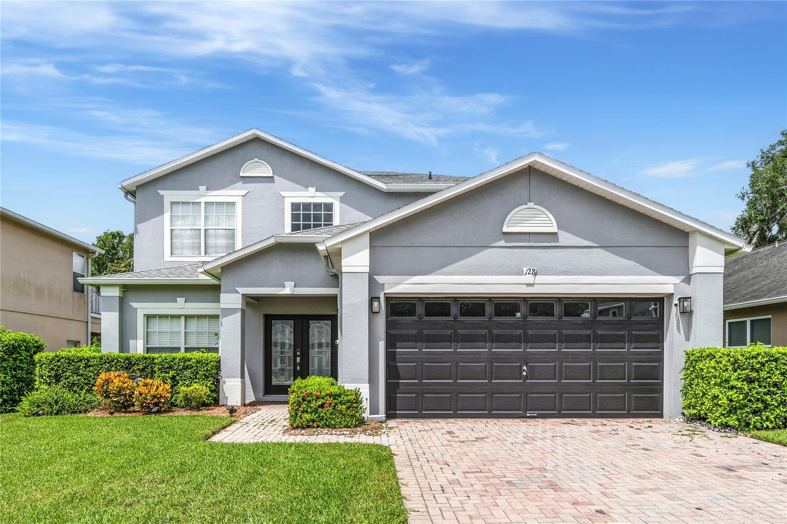 Welcome to Calabria Cove – Where Neighbors Become Family.
It’s rare to find an exclusive, tight-knit community where neighbors look out for one another and friendships feel more like family. That’s exactly what makes Calabria Cove so special. This charming enclave of just 33 homes is a sanctuary of warmth and connection—a place where newcomers are welcomed with open arms and community pride shines on its street.
At the heart of this exceptional neighborhood is a well-designed residence built by Beazer Homes USA, one of the nation’s most respected and trusted builders. Known for their thoughtful floorplans and enduring craftsmanship, Beazer delivers homes that are built to last—ensuring peace of mind and quality living for years to come. When you arrive you will be greeted by a elegant elevation of the homes design and a pavered driveway.
Step through the double, glass doors and into an interior where soaring ceilings, elegant crown molding, and abundant natural light create an inviting atmosphere from the moment you arrive. To the left, custom barn doors open to a versatile flex room perfect as a home office, guest suite, or second downstairs bedroom.
The heart of the home is the dreamy chef’s kitchen, beautifully renovated with timeless Shaker-style cabinetry, “Giallo Ornamental” granite countertops, a spacious center island, and a sleek downdraft framed by linen subway tile. A charming breakfast nook is the perfect spot for casual dining or morning coffee, while the kitchen seamlessly flows into the family room highlighted by detailed millwork, a custom media center, and rich walnut-stained plank wood flooring.
The first-floor primary suite is a private retreat, styled in a calming Mindful Grey palette and filled with natural light. The spa-inspired bath features dual ebony vanities with picture-frame mirrors, a soaking tub, and a separate shower for the ultimate in comfort and relaxation.
Upstairs, a spacious second family room offers the perfect hangout or study space, complete with a built-in niche ideal for a home office or homework station. Four additional generously sized bedrooms and two full baths complete the second level, offering flexibility for every lifestyle.
This home has been thoughtfully refreshed and lovingly maintained, with major systems recently replaced—ensuring years of worry-free living. Outdoors, sliding glass doors lead to a screened lanai and fully fenced backyard, where peaceful wooded views provide a private retreat for morning coffee, afternoon gatherings, or laid-back weekends.
Beyond the home, Calabria Cove’s boutique community vibe is enhanced by its prime location. Residents enjoy top-rated Seminole County schools, including walking distance to Bentley Elementary and Kirby Park. With easy access to SR-417 and I-4, you’re minutes from Colonial Town Park, Sun Rail, the Seminole Wekiva Trail, three hospitals, and the area’s finest dining, shopping, and nightlife.
? This is more than a home—it’s a lifestyle in a rare community where neighbors truly care for one another. Don’t miss your chance to call Calabria Cove home.