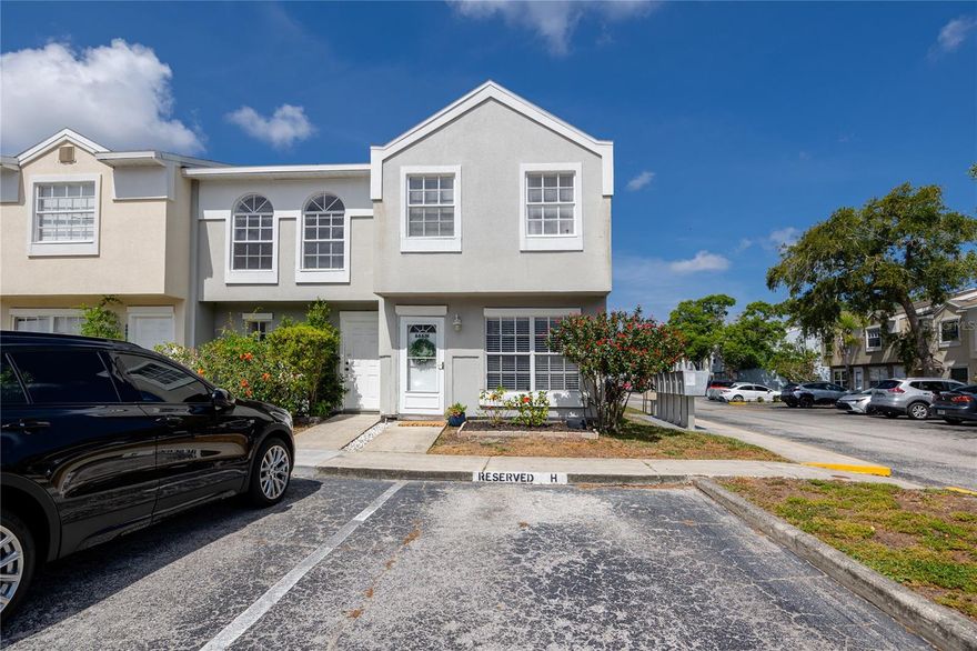 Check out this rare END unit in Pinebrook Estates featuring 3 bedrooms. Located in the heart of Pinellas County & close to shopping, access to Tampa, St. Pete airport, and a quick drive to the best beaches in the nation. Step inside to your living room with a charming brick fireplace & room for entertaining. A powder room on the main floor perfect for guests to use! Move towards your beautiful kitchen updated with stainless steel appliances including an LG refrigerator, dishwasher, built-in microwave, & plenty of counter space to meal prep. The breakfast bar opens to the dining area ideal for entertaining offering flexibility for both casual & sit-down dining. You will find the laundry room conveniently located inside on the main floor. Enjoy your morning coffee in your screened lanai with a beautiful pond view. Extra bonus: an outdoor storage room for all your extra holiday decor, tools, or beach items plus more storage under the stairs. Upstairs, you will find a freshly painted hallway leading to three bedrooms, & two full bathrooms. You will find two generously sized bedrooms that share a bathroom while the primary suite features an en-suite bathroom. There is ample closet space throughout, no need to argue over closet space! Low HOA includes exterior, pest, pool, ground maintenance & roof. Lawn care is included but you can plant & garden in your own area, if you have a green thumb, or leave the maintenance-free plants. The roof was replaced in 2025, offering added peace of mind. This unit includes one reserved parking spot & plenty of guest parking. Pinebrook is pet friendly with no weight or breed restrictions for dogs. This unit is a short walk to Pinebrook park with a playground, basketball courts, pickleball and a dog park. Schedule your showing to your slice of sunny Florida!