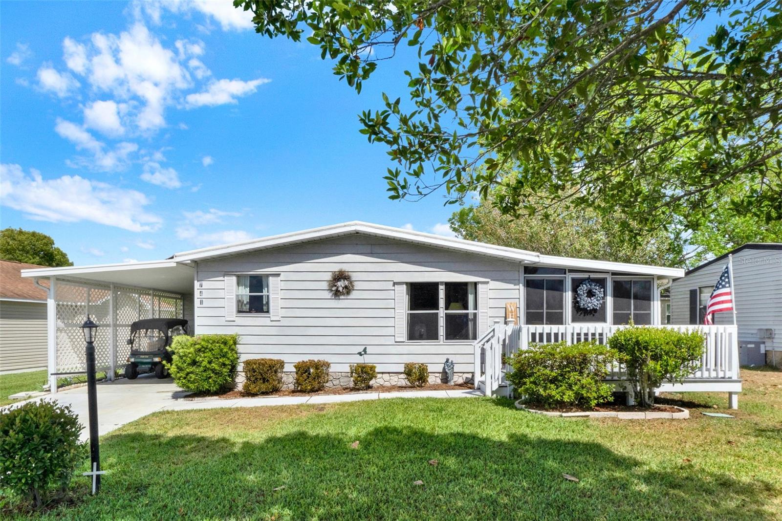 2-bedroom, 2-bath home is full of potential and recent updates. You'll appreciate the new irrigation system, composite deck, new acrylic windows on the lanai, and a 2022 AC unit for year-round comfort. Inside, enjoy ample storage from the generous kitchen cabinetry to the built-in dining buffet and surprisingly large closets. Whether you're looking for a seasonal escape, investment, or a project to make your own, this one checks the boxes. Plus, you're just a golf cart ride away from the Orange Blossom pool, golf, and shopping. No bond!
Charming opportunity in the heart of Orange Blossom Gardens! Village of Silver Lake in The Villages, providing convenient access to nearby amenities such as the Orange Blossom Hills Golf & Country Club with a gorgeous waterfall and the community pool with one of the only hot tubs!