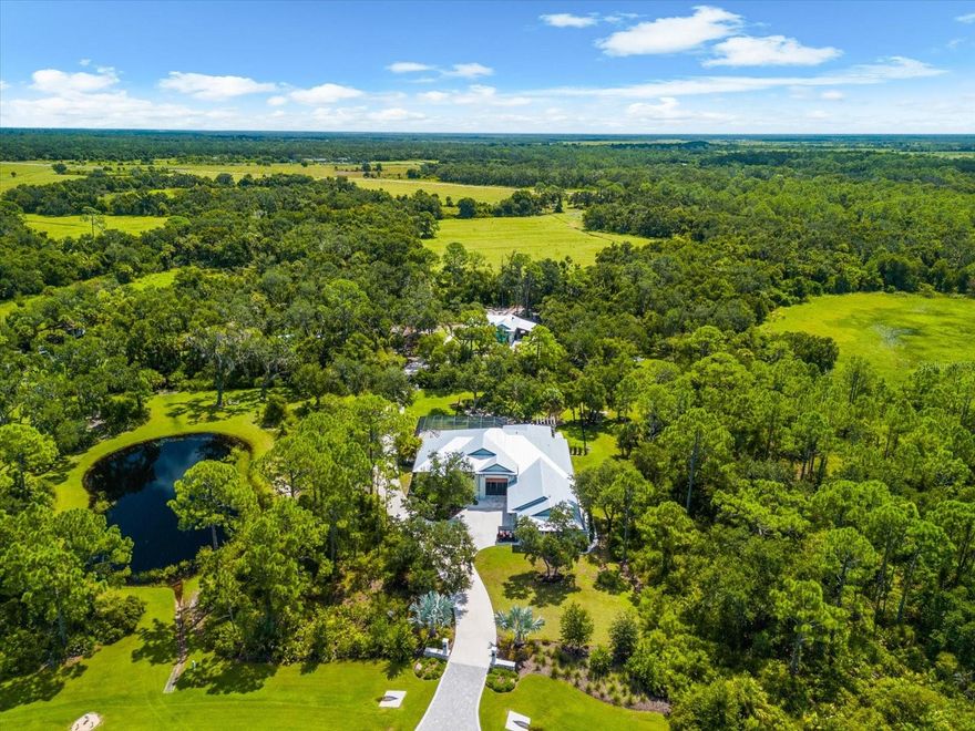 Welcome to 10808 Leafwing Drive, a private 3.64-acre estate in Sarasota’s exclusive gated community, The Forest at Hi Hat Ranch. Designed and built in 2021, this custom-crafted residence—known as The David—is a rare opportunity to experience modern luxury seamlessly blended with the tranquility of nature. Every element of this home was thoughtfully designed to deliver sophistication, privacy, and the finest in Florida living. 

The main residence spans more than 5,500 square feet in total, with 3,352 square feet of air-conditioned living space centered around an open, airy floorplan. A dramatic 23-by-34-foot great room serves as the heart of the home, with soaring ceilings, a fireplace, and expansive glass doors that frame peaceful views of Lake Wood and the surrounding conservation land. The chef’s kitchen is equally impressive, featuring custom wood cabinetry, stone counters, top-tier appliances, walk-in pantry, and generous workspace for both everyday living and large-scale entertaining. There are a total of 4 bedrooms - 1 is currently used as an office which has an adjacent bathroom.

The primary suite was designed as a private retreat, complete with a spa-inspired bath featuring a soaking tub, oversized walk-in shower, dual vanities, and a spacious custom closet. Two additional guest suites with walk-in closets and en suite baths lend comfort and privacy. A versatile study with its own walk-in closet provides flexibility as a home office, library, or additional bedroom.

Enhancing the property’s versatility, a detached casita offers an additional 600 square feet with a private bath and kitchenette—perfect for extended family, long-term guests, or multigenerational living.

Outdoor living takes center stage in this estate, with a heated saltwater pool featuring a sun shelf, fiber optic lighting, and an integrated spa. The expansive screened lanai with summer kitchen, outdoor dining, and multiple lounge areas creates a seamless indoor-outdoor lifestyle. Mature landscaping, irrigation system, and private fencing further enhance the serene setting.

Additional features include a four-car garage with carport parking, golf cart and RV accommodations, storm protection, whole-house water filtration and reverse osmosis systems, and energy-efficient design throughout.

Beyond the property, residents of The Forest at Hi Hat Ranch enjoy the rare combination of seclusion and convenience. Just minutes from downtown Sarasota, world-class beaches, fine dining, golf, and cultural venues, this estate provides both privacy and access to everything that makes Sarasota one of Florida’s most desirable destinations.

10808 Leafwing Drive is more than a residence—it is an estate of distinction that offers timeless craftsmanship, luxurious amenities, and an unparalleled Florida lifestyle.